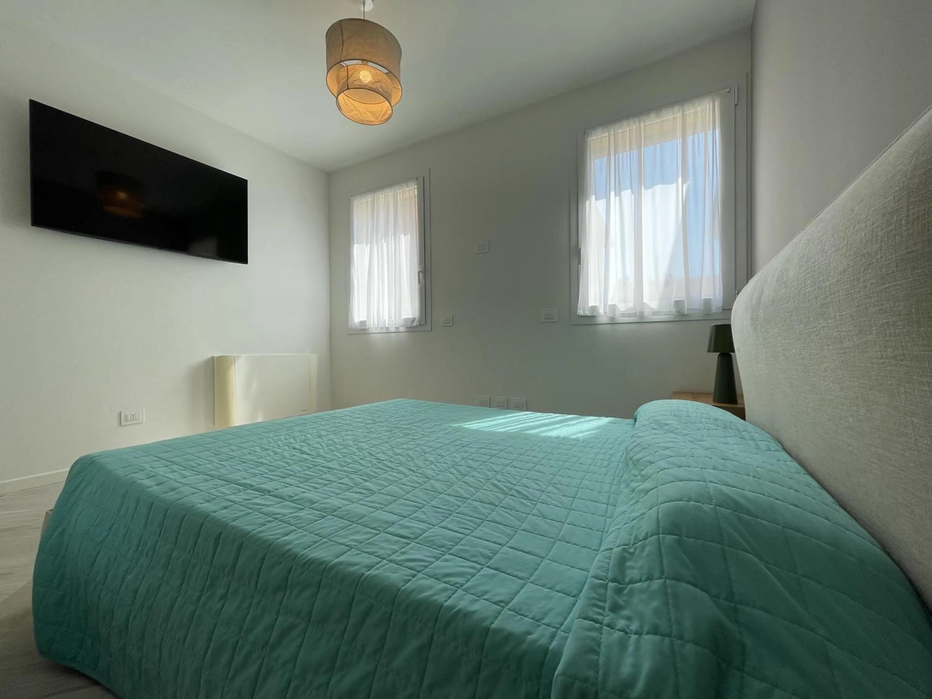 Bed in Gli Scogli Luxury Residence Hotel