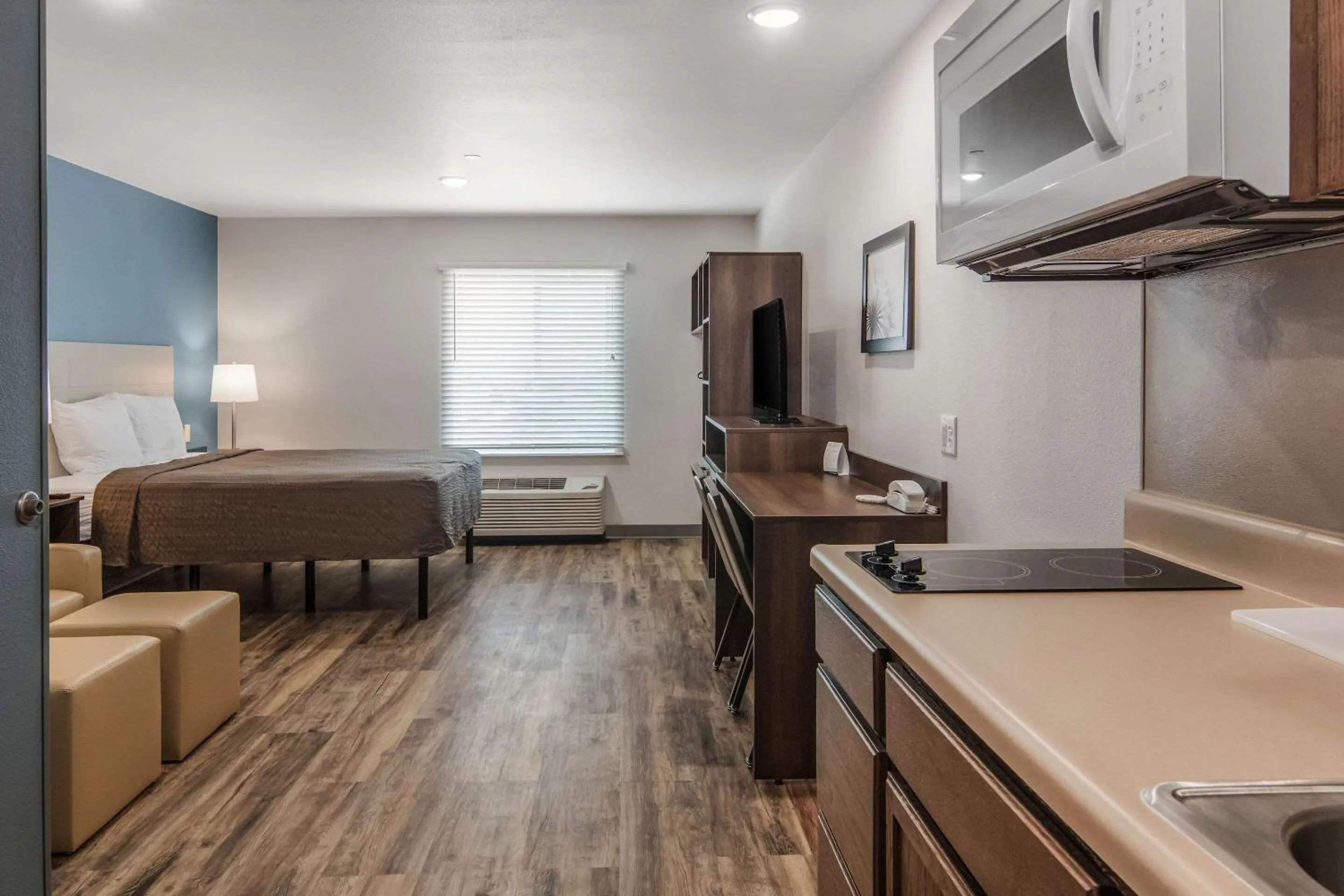 Photo of the whole room, Bed in WoodSpring Suites North Ft Worth Alliance TX Speedway