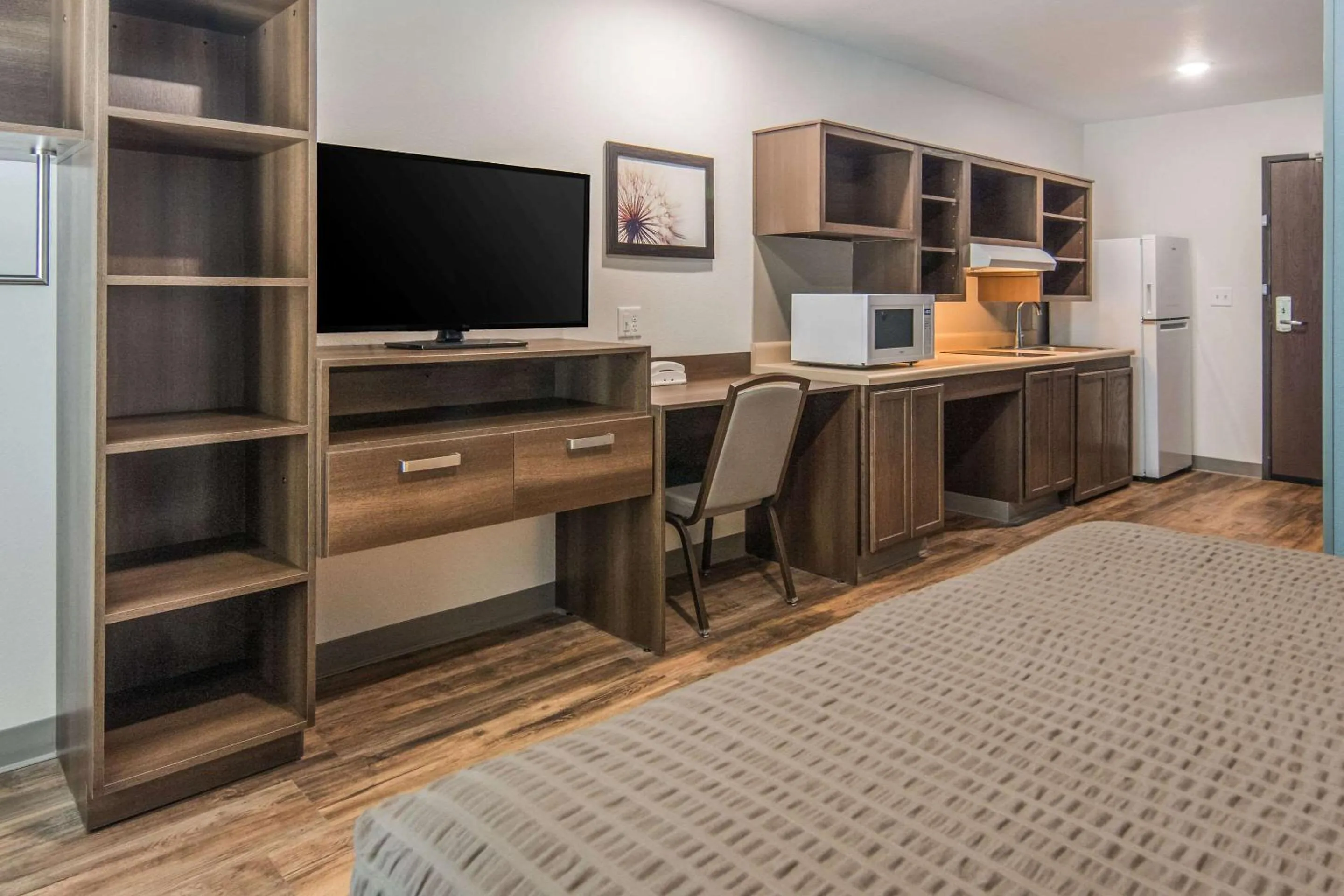 Photo of the whole room, Bed in WoodSpring Suites North Ft Worth Alliance TX Speedway