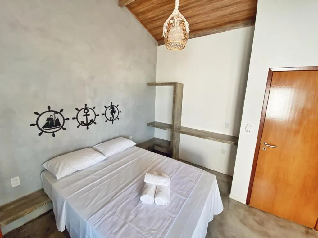 Bed in Pousada Primeira Praia Suítes