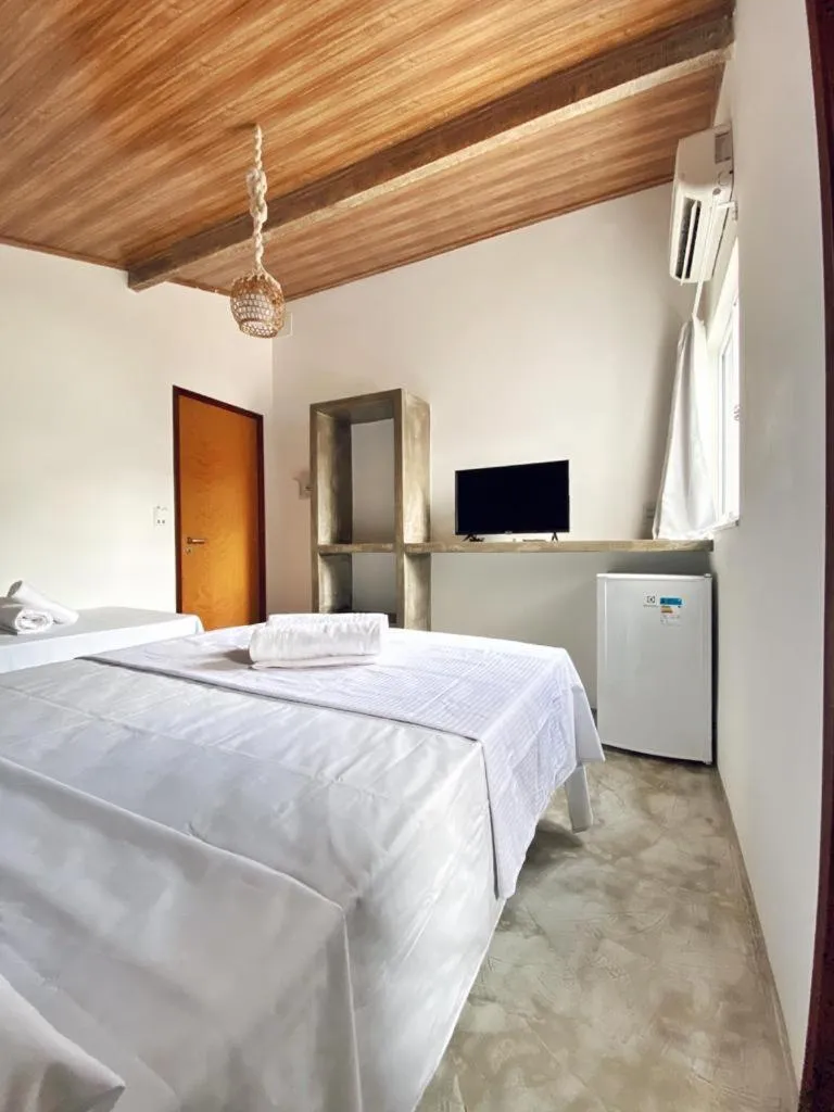 Bed in Pousada Primeira Praia Suítes
