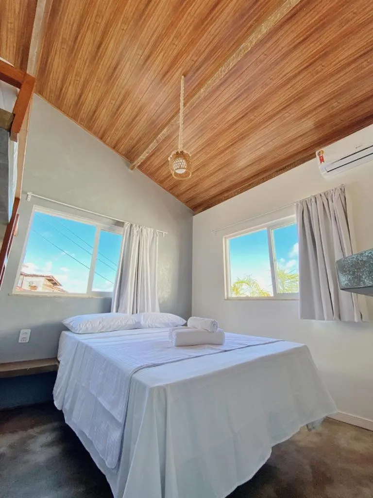 Bed in Pousada Primeira Praia Suítes