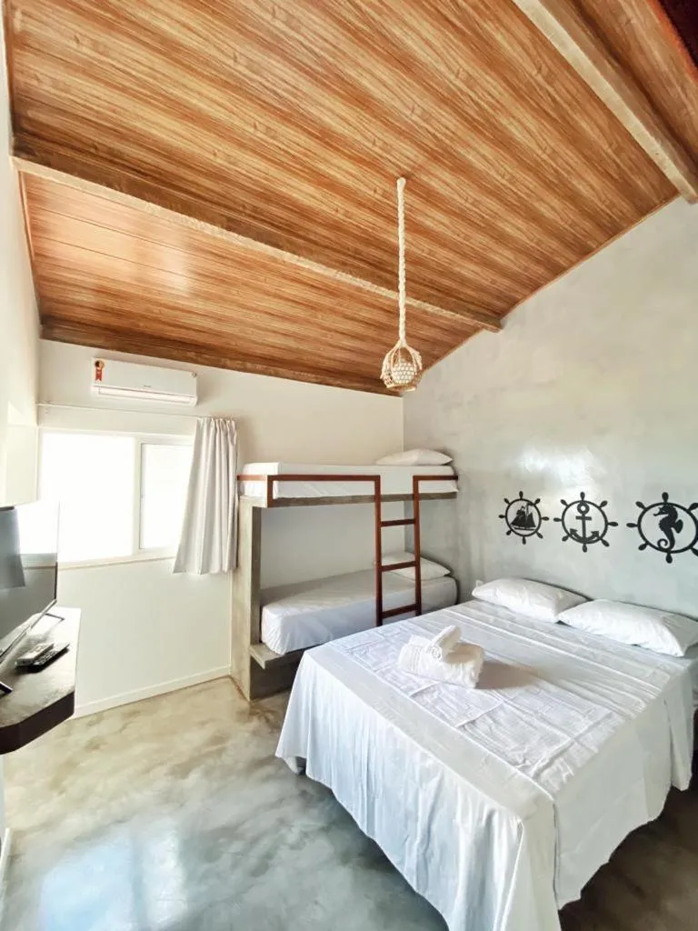 Bed in Pousada Primeira Praia Suítes