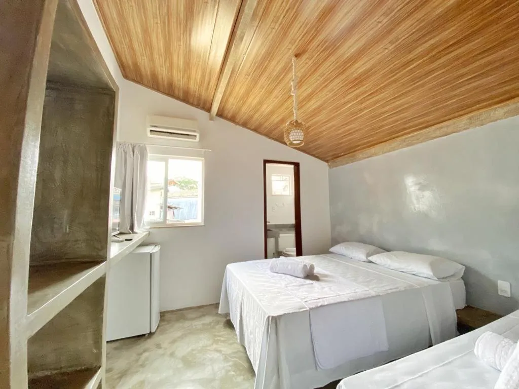 Bed in Pousada Primeira Praia Suítes