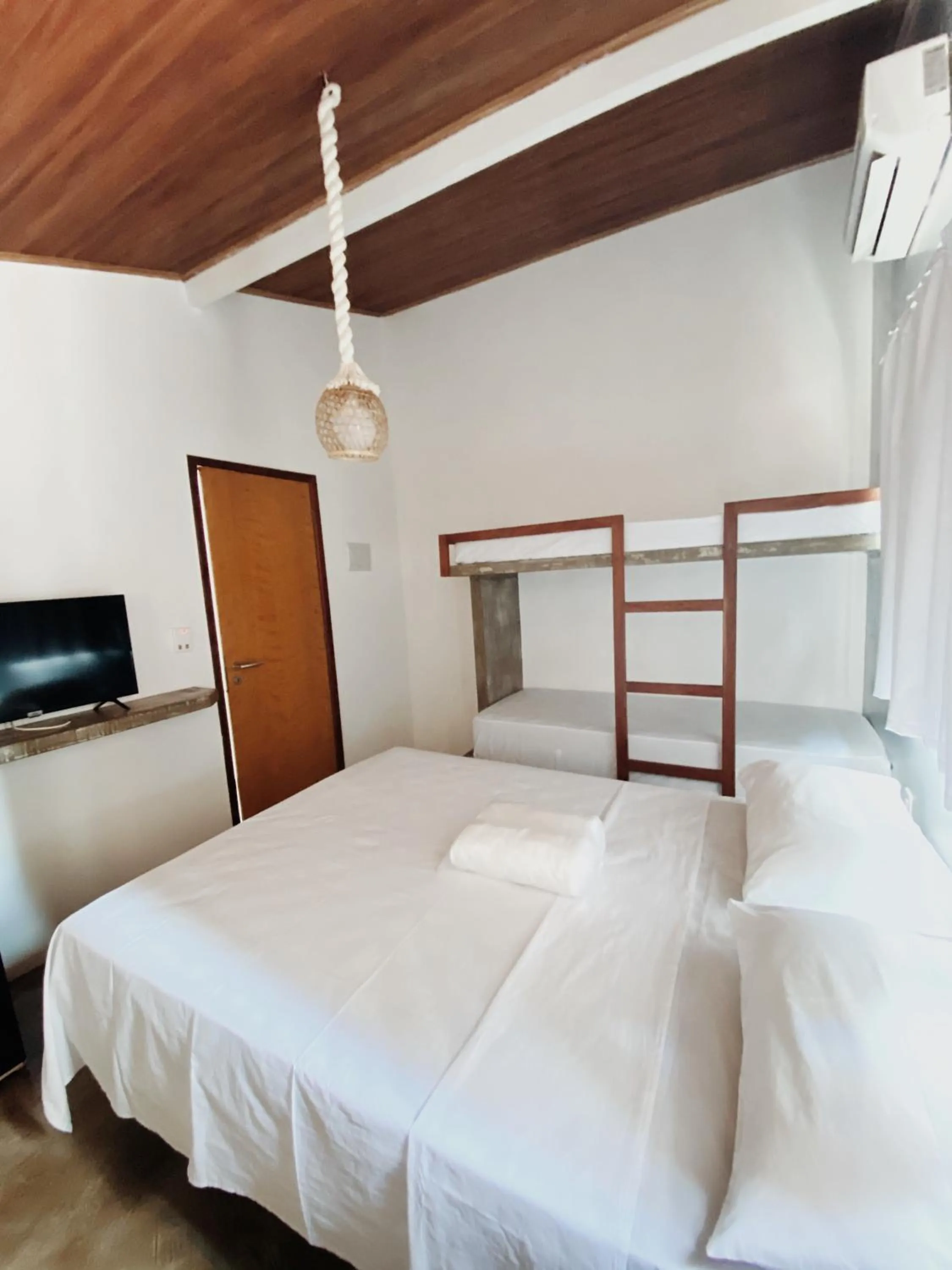 Bed in Pousada Primeira Praia Suítes