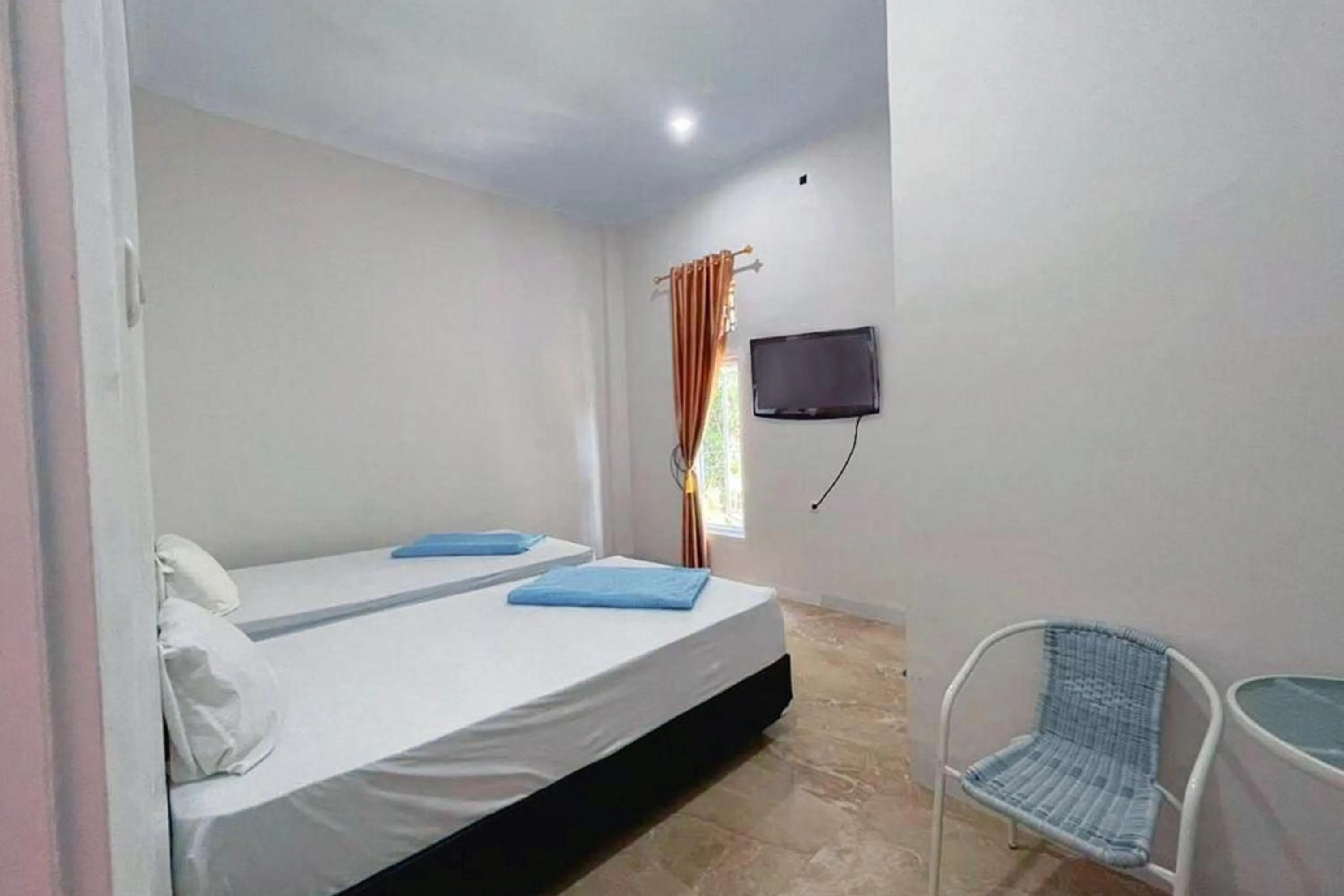 Bed in Wisma Maestro Toraja Mitra RedDoorz