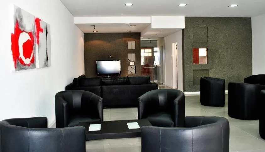Communal lounge/ TV room in Pilar Apart Hotel