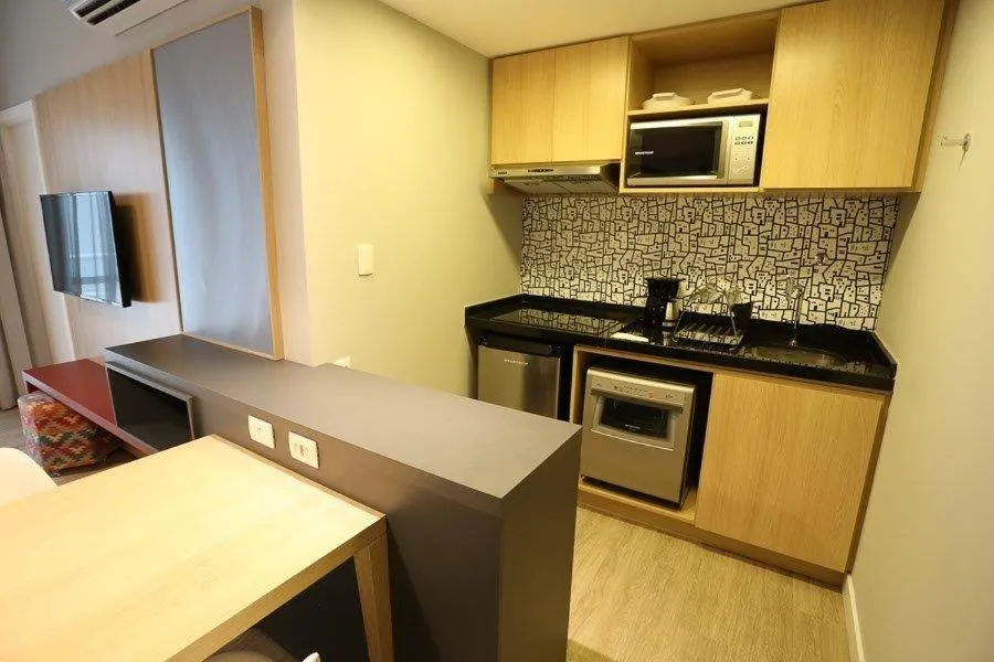 Kitchen or kitchenette in Astron Suítes Mondial Salvador by Nobile