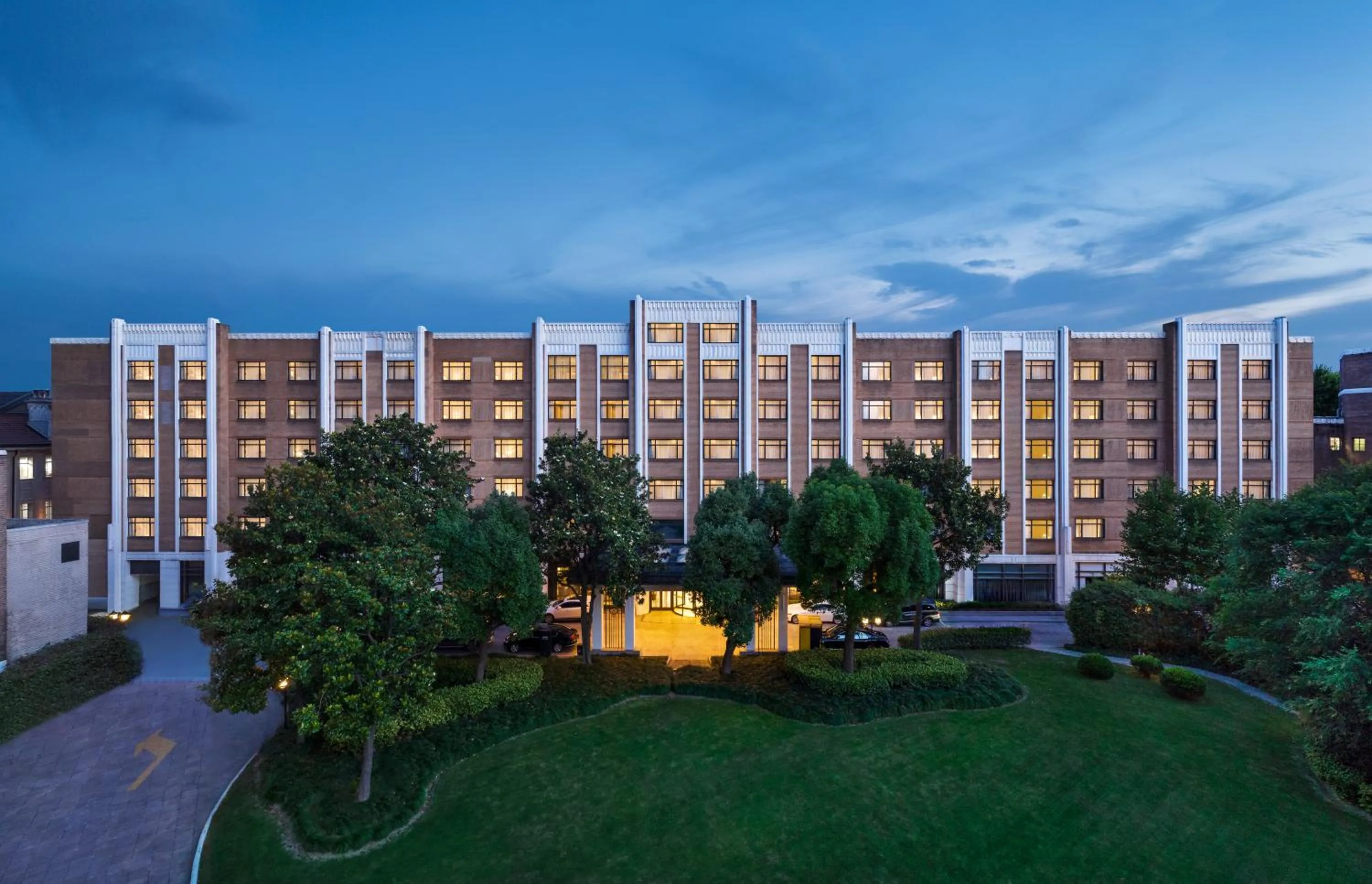 Property building in Jin Jiang Hotel Shanghai - historical hotel in the city-center of Huaihai shopping area and convenient access to metro lines