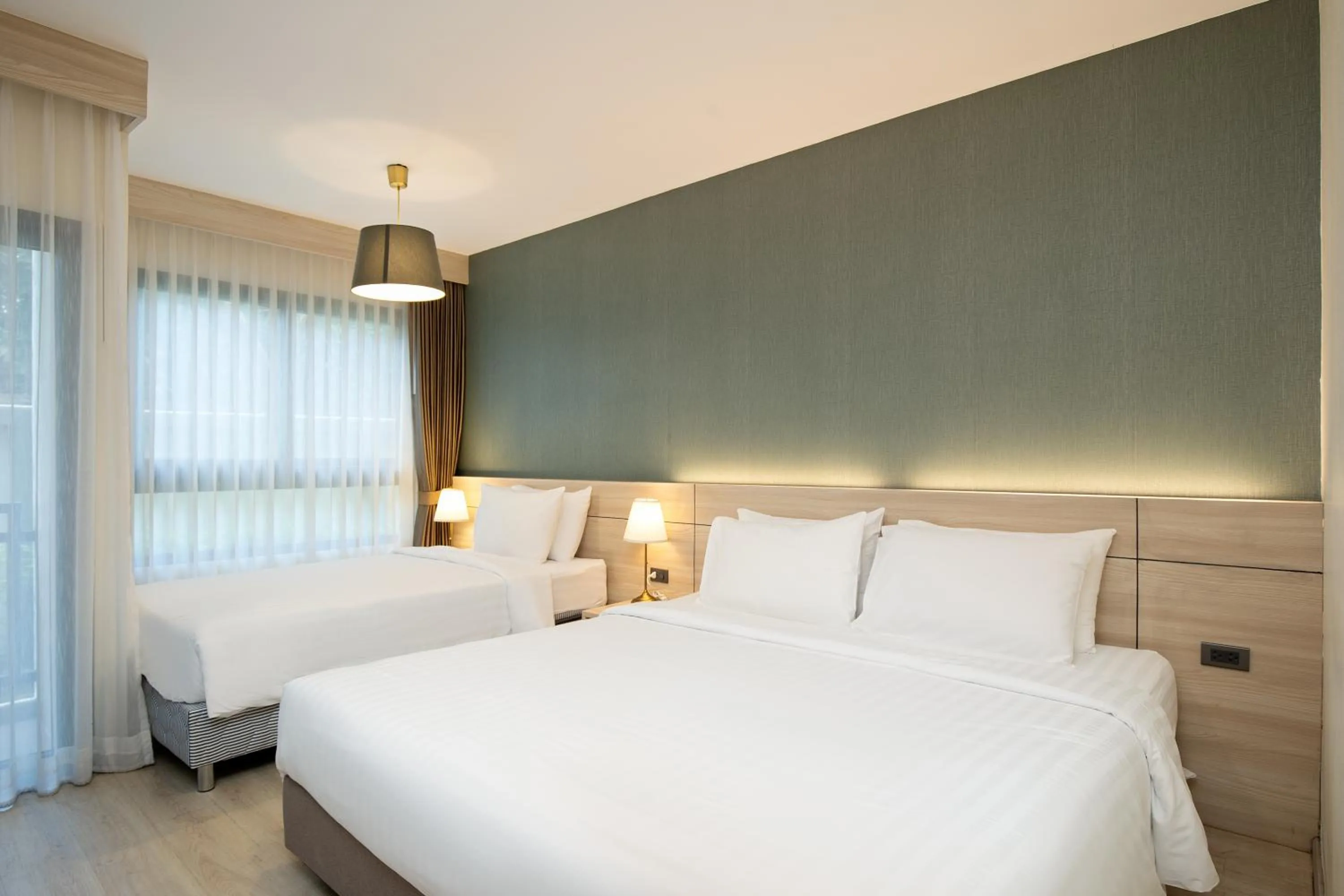 Bed in Amanah Bangkok Hotel