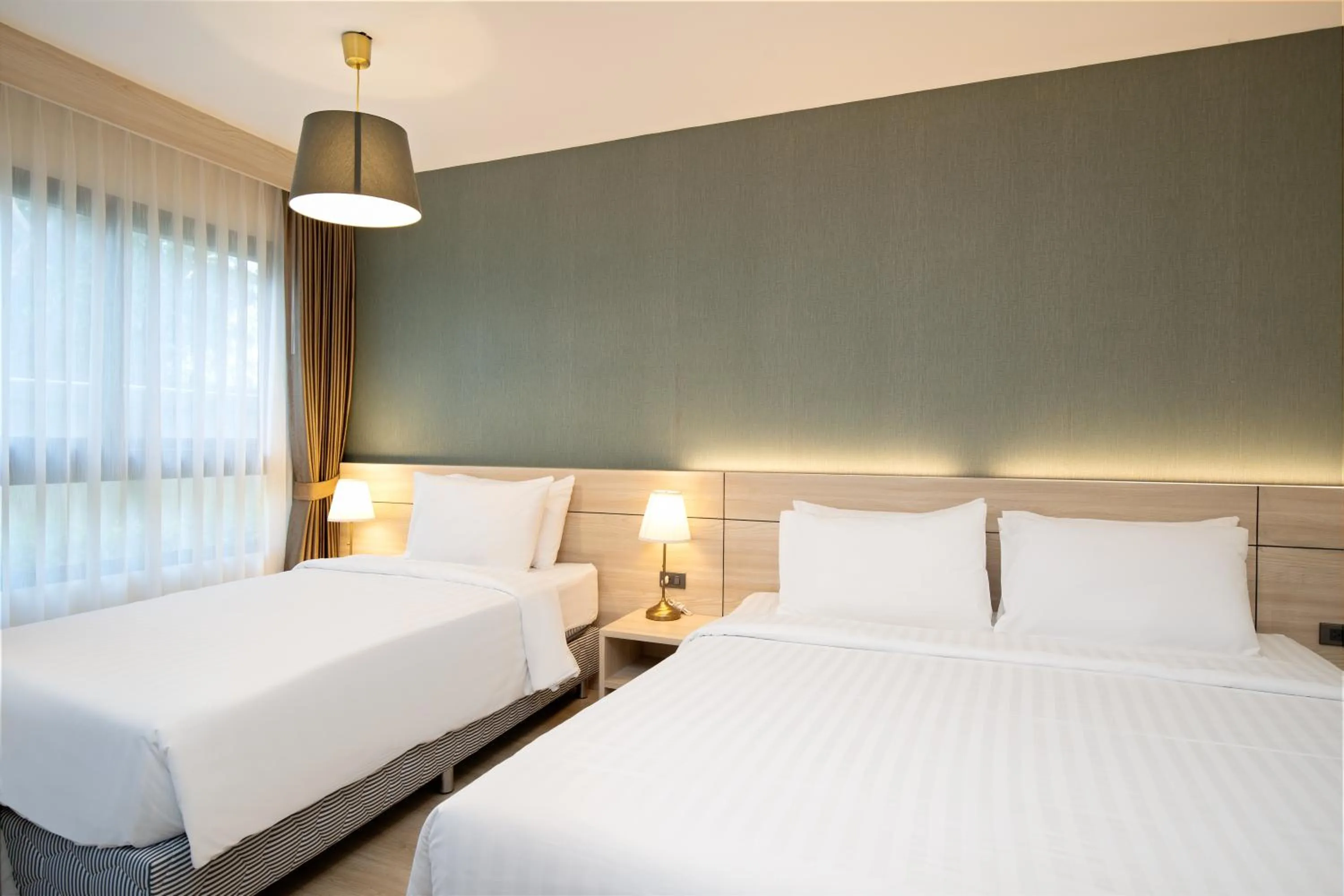 Bed in Amanah Bangkok Hotel