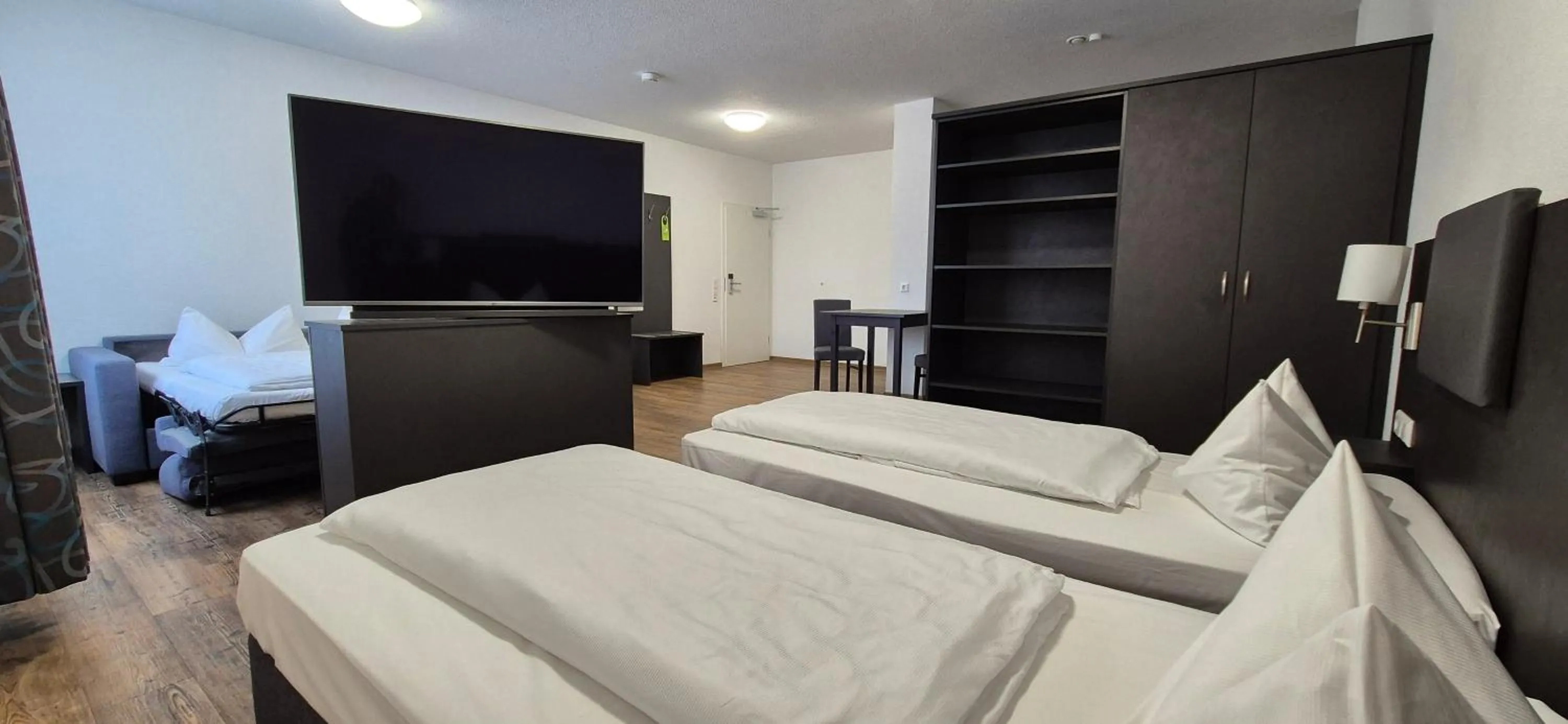 Photo of the whole room, Bed in Melvi Hotel Göppingen