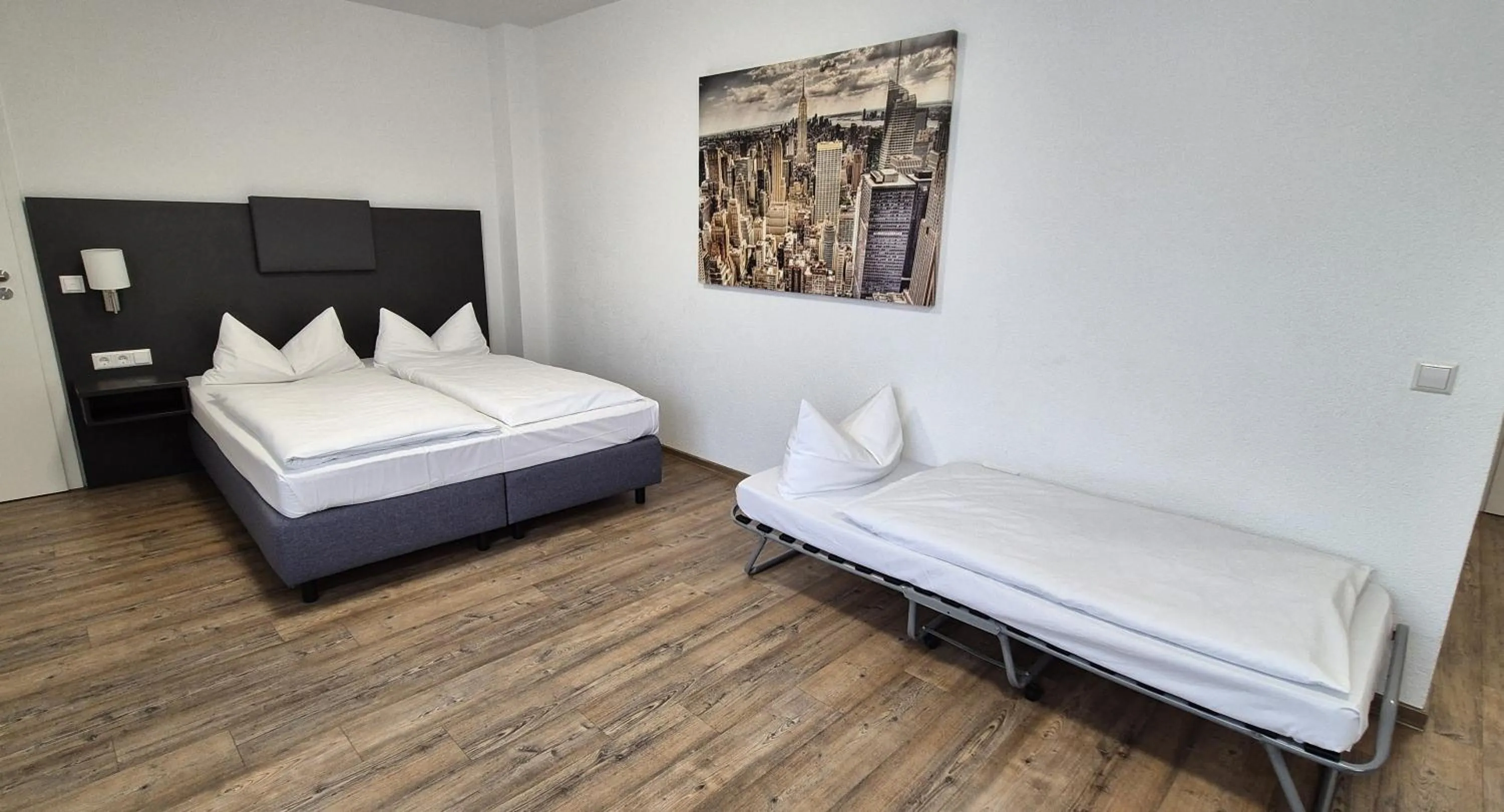 Photo of the whole room, Bed in Melvi Hotel Göppingen