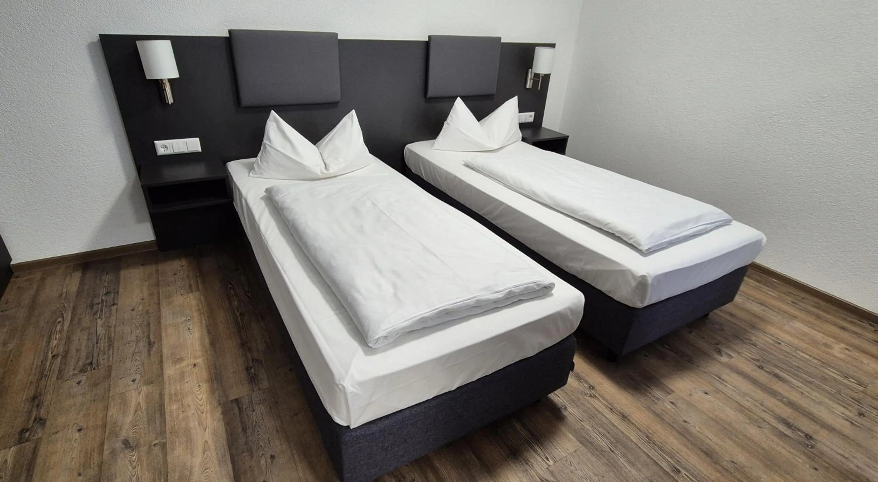 Photo of the whole room, Bed in Melvi Hotel Göppingen