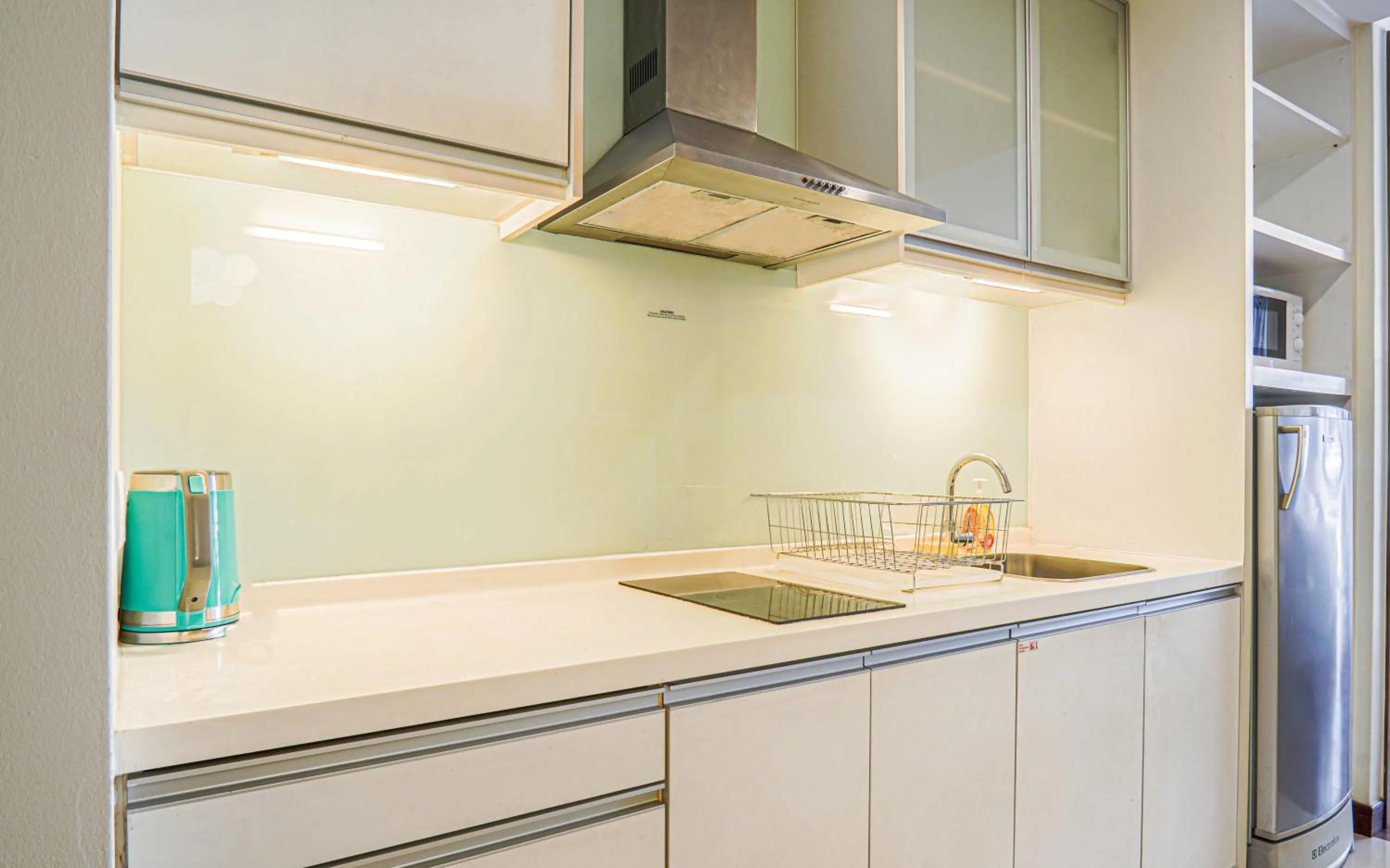 Kitchen or kitchenette in Lot 163 at Cormar Suites by Airhost