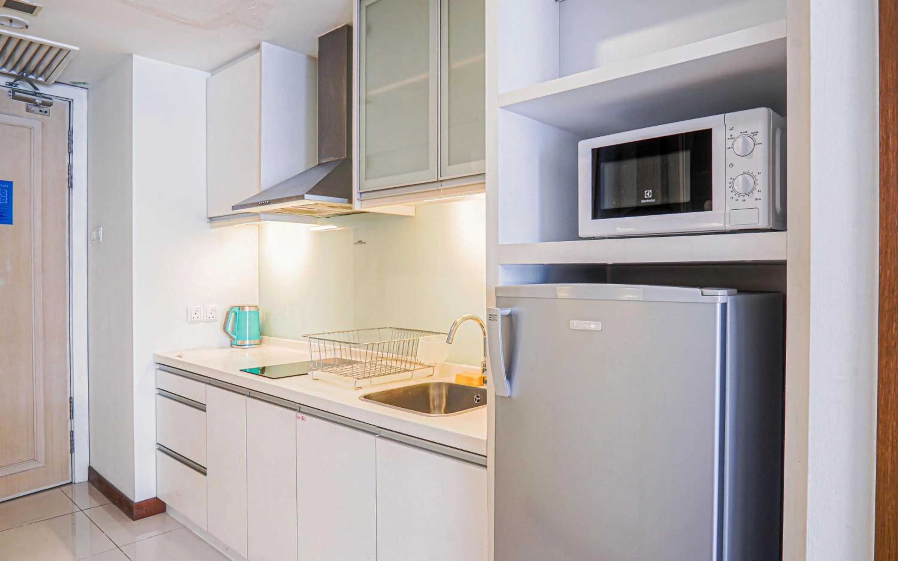 Kitchen or kitchenette in Lot 163 at Cormar Suites by Airhost