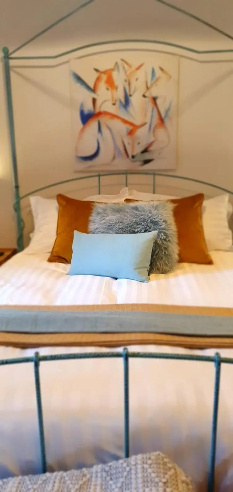 Bed in The Orange Fox Lux Room and Hot Tub at The Grumpy Schnauzer Guest House