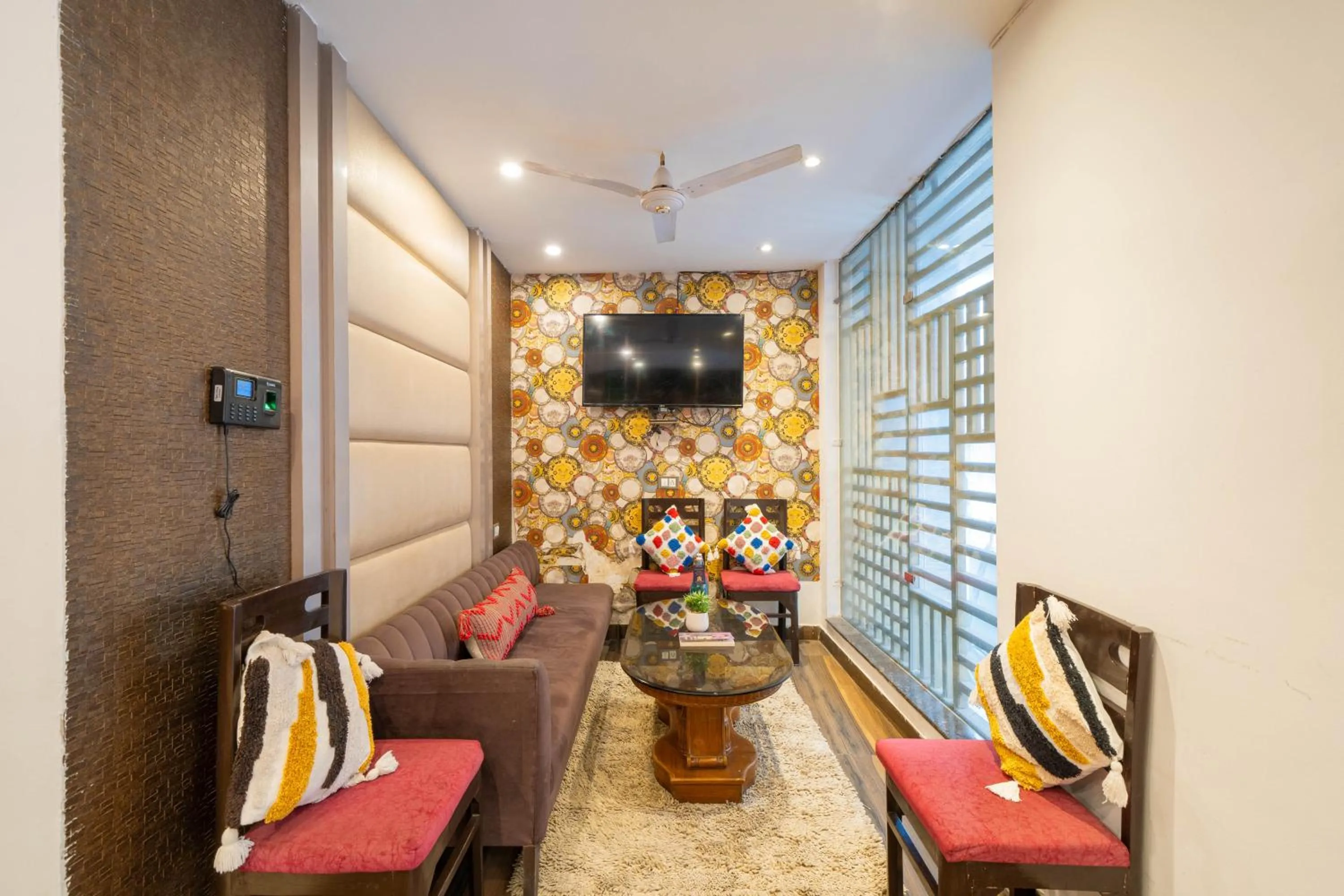 Communal lounge/ TV room in Perfectstayz Premium Ganga Heights - Ganga View rooftop cafe