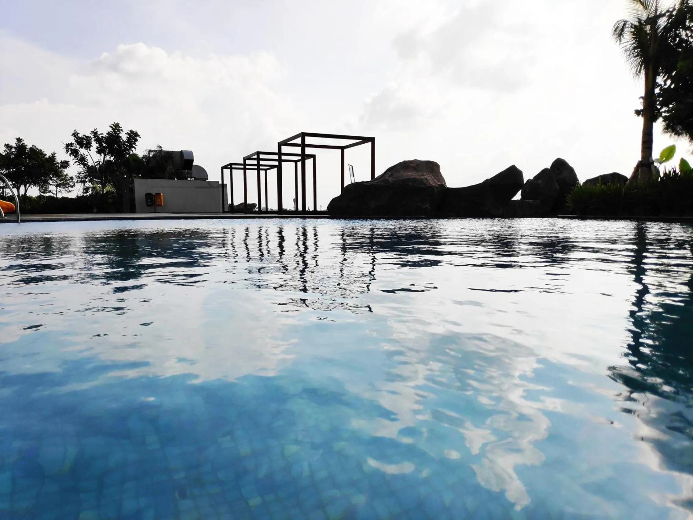 Pool view in Apartemen Grand Kamala Lagoon by 21 Room