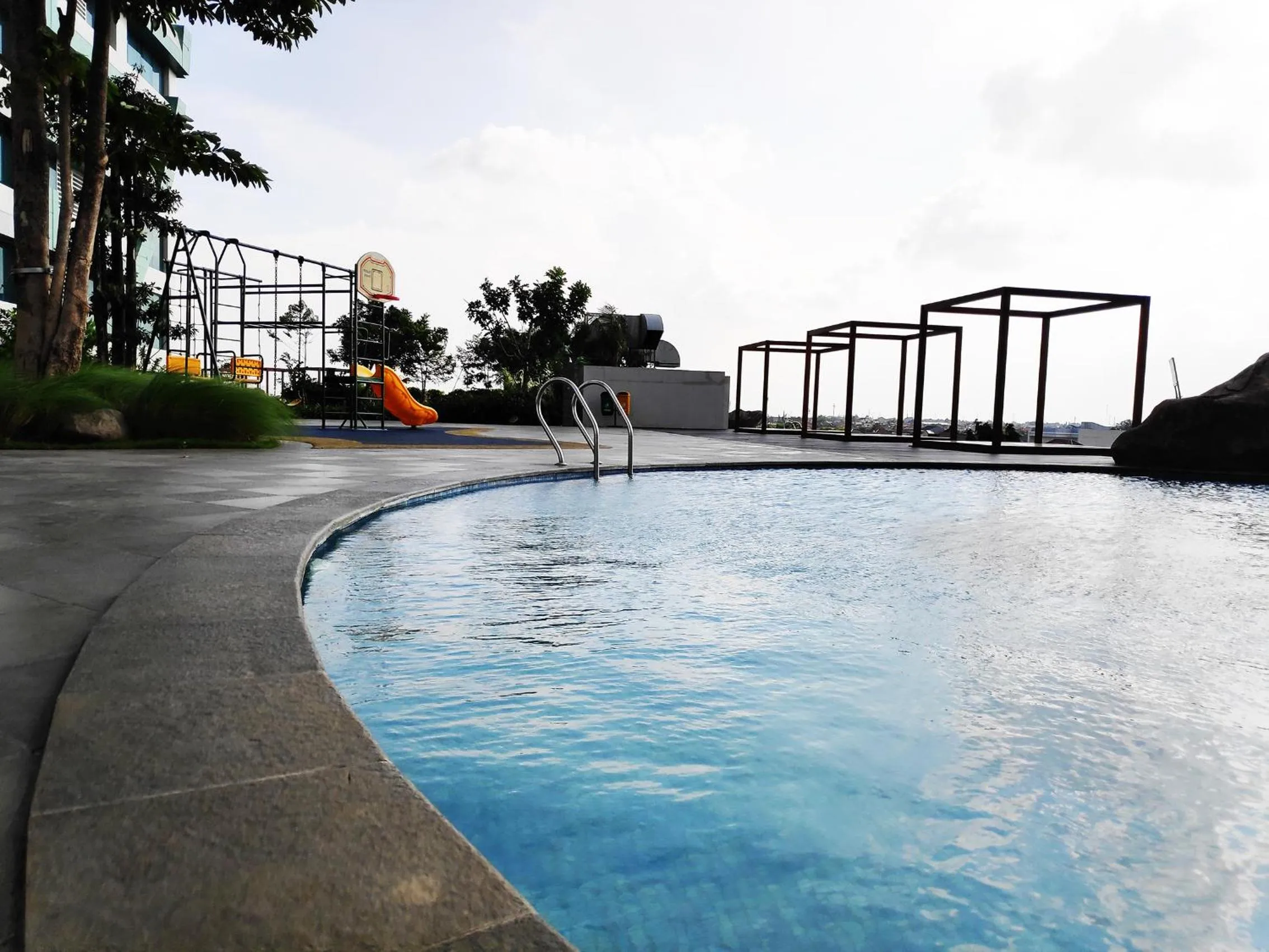 Swimming pool in Apartemen Grand Kamala Lagoon by 21 Room