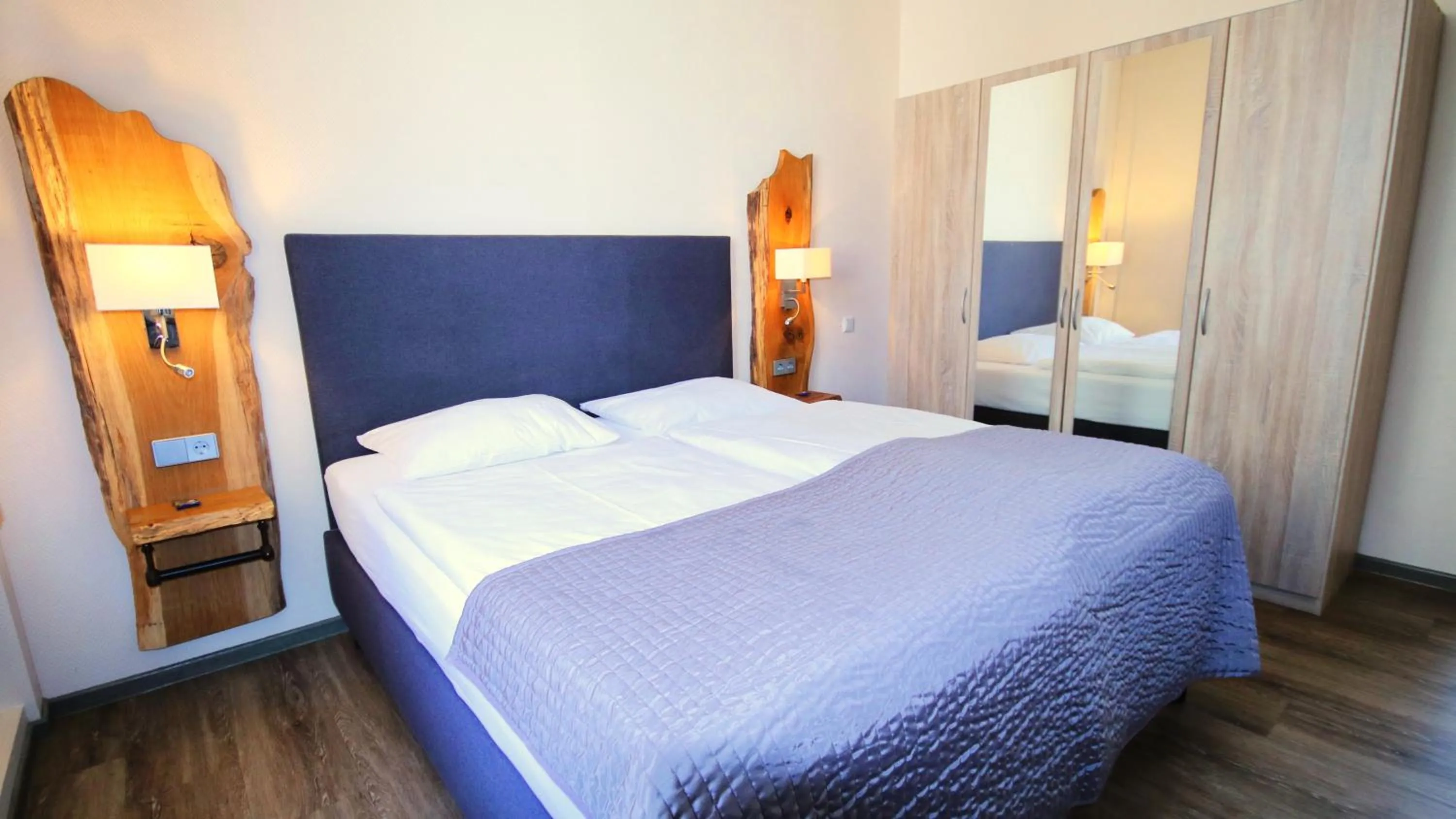 Photo of the whole room, Bed in Komfort Hotel Am Kurpark