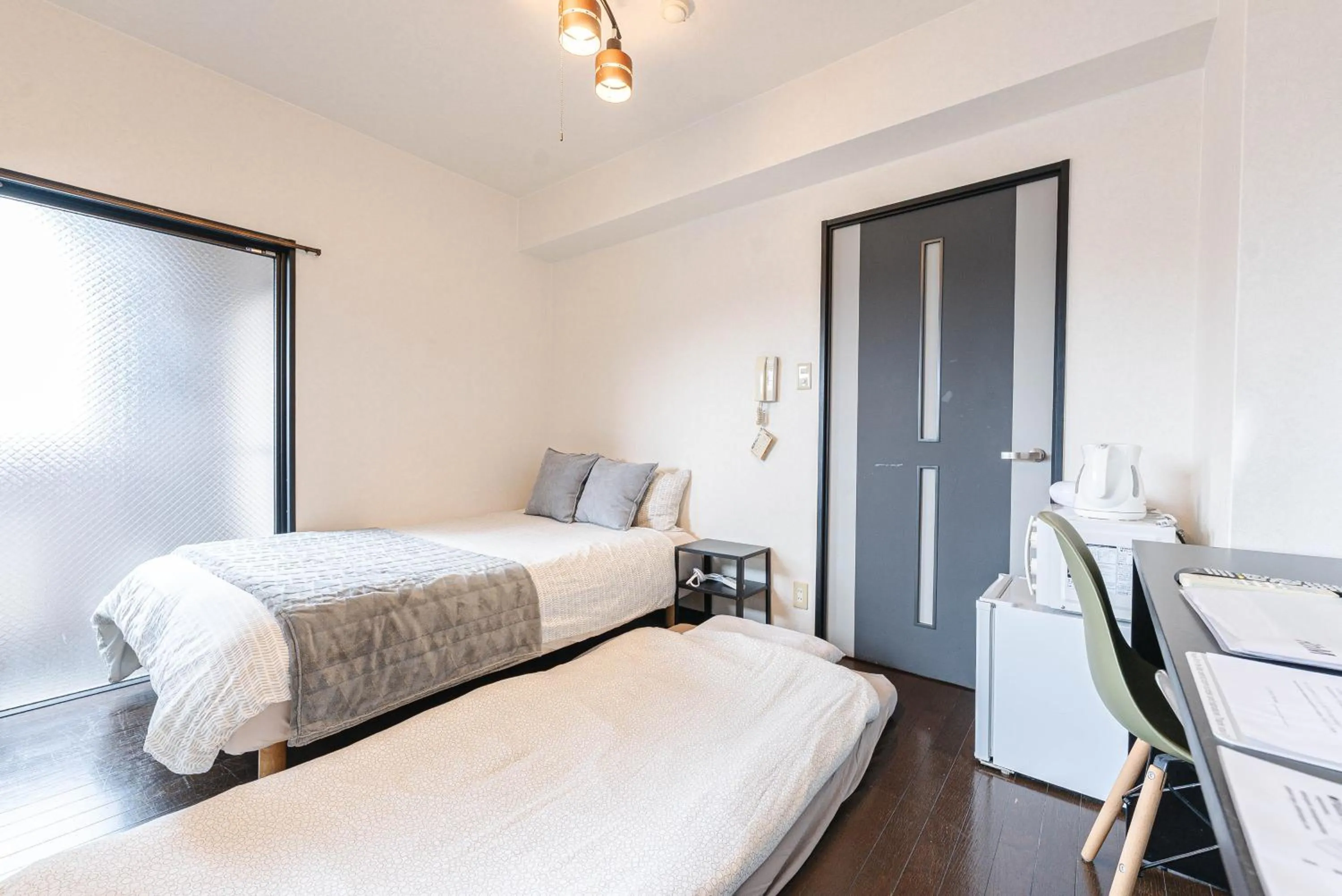 Bed in SUMIYOSHI APARTMENT Hotel 住吉アパートメントホテル