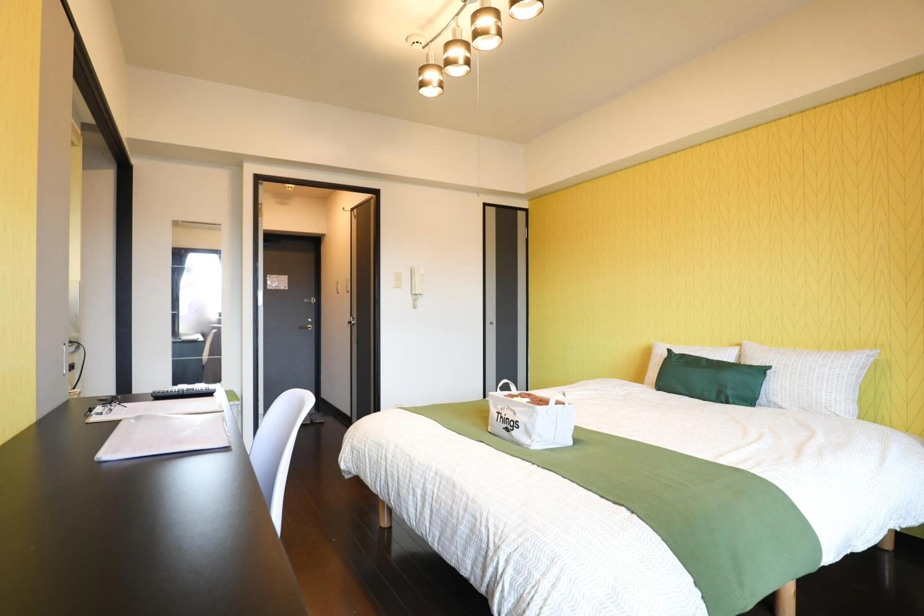 Bed in SUMIYOSHI APARTMENT Hotel 住吉アパートメントホテル