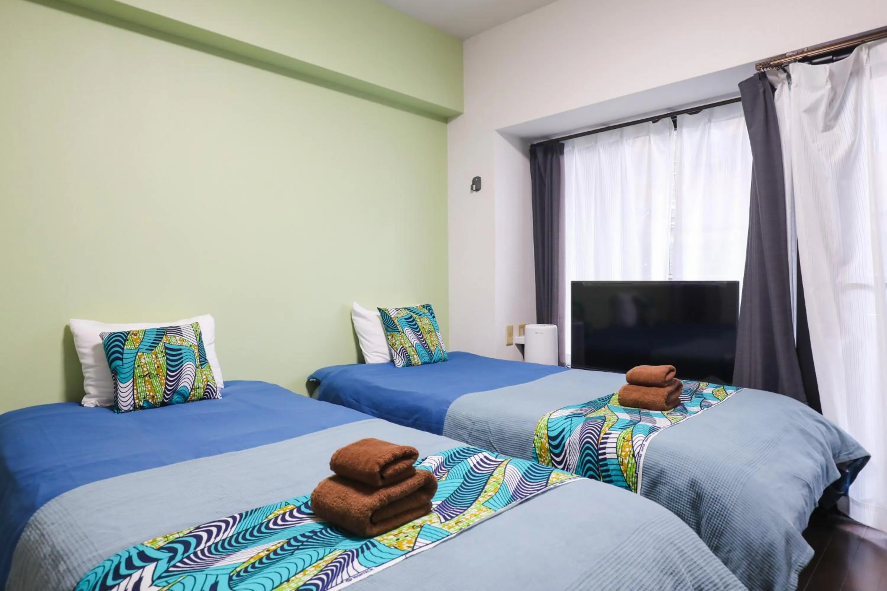 Bed in SUMIYOSHI APARTMENT Hotel 住吉アパートメントホテル