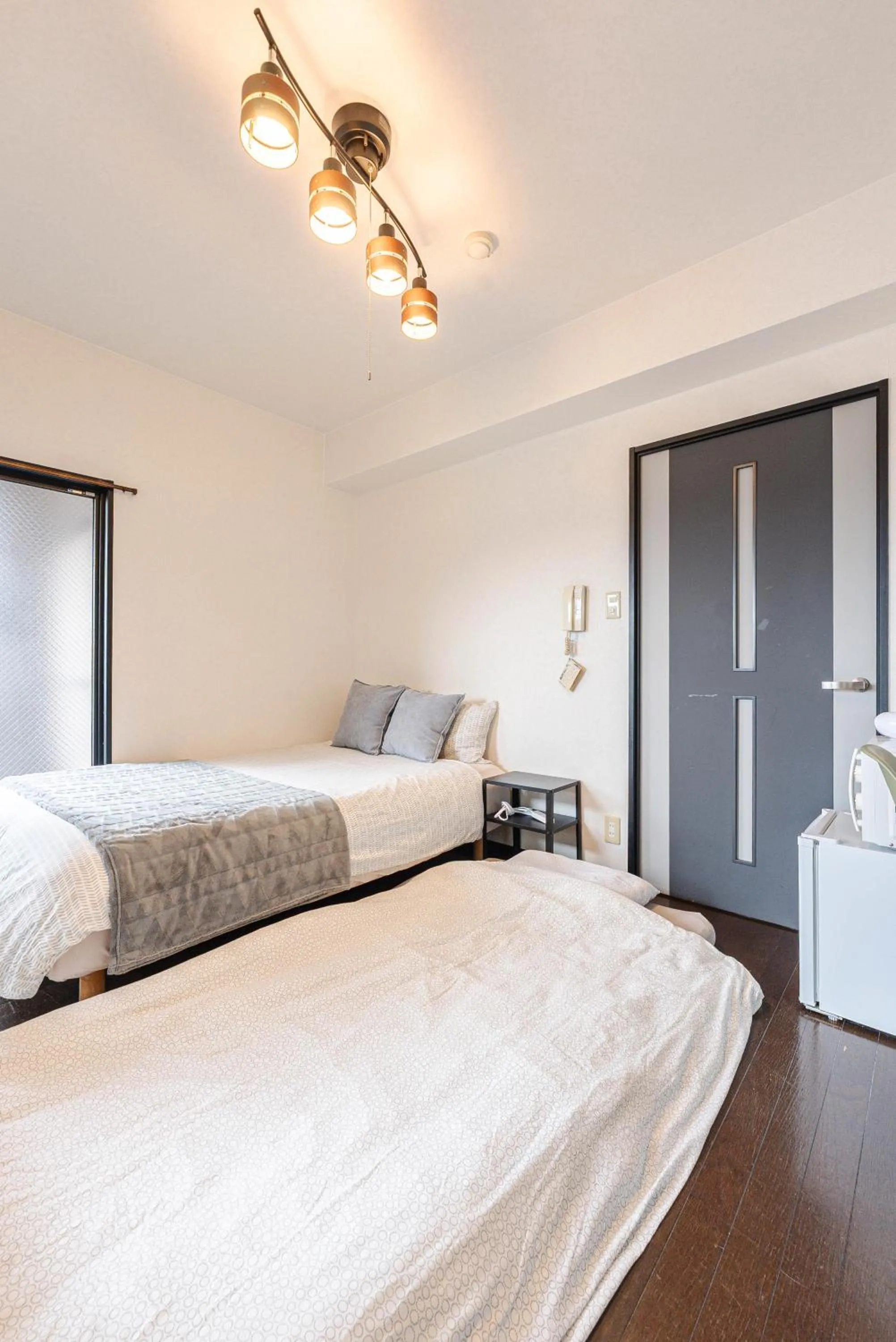 Bed in SUMIYOSHI APARTMENT Hotel 住吉アパートメントホテル