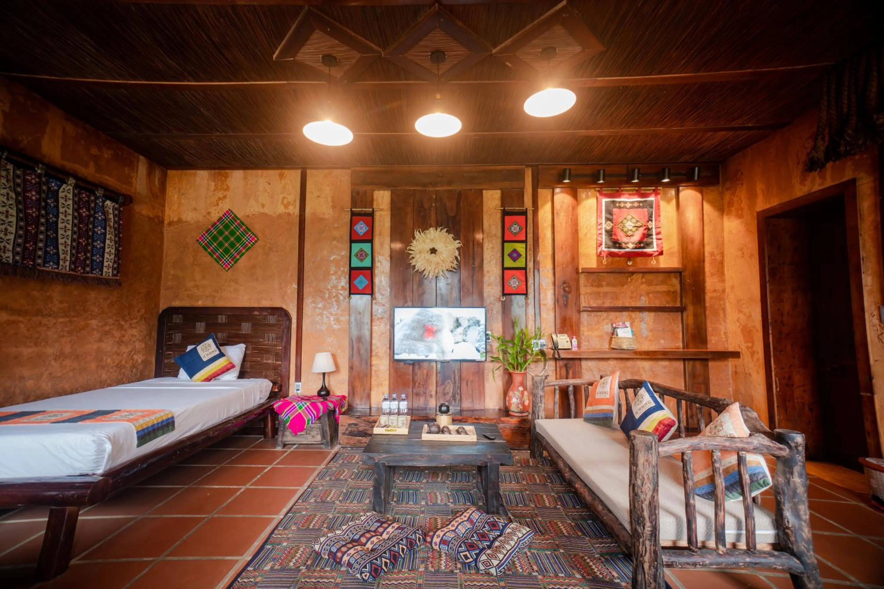 Living room, Bed in H'mong Village Resort Ha Giang