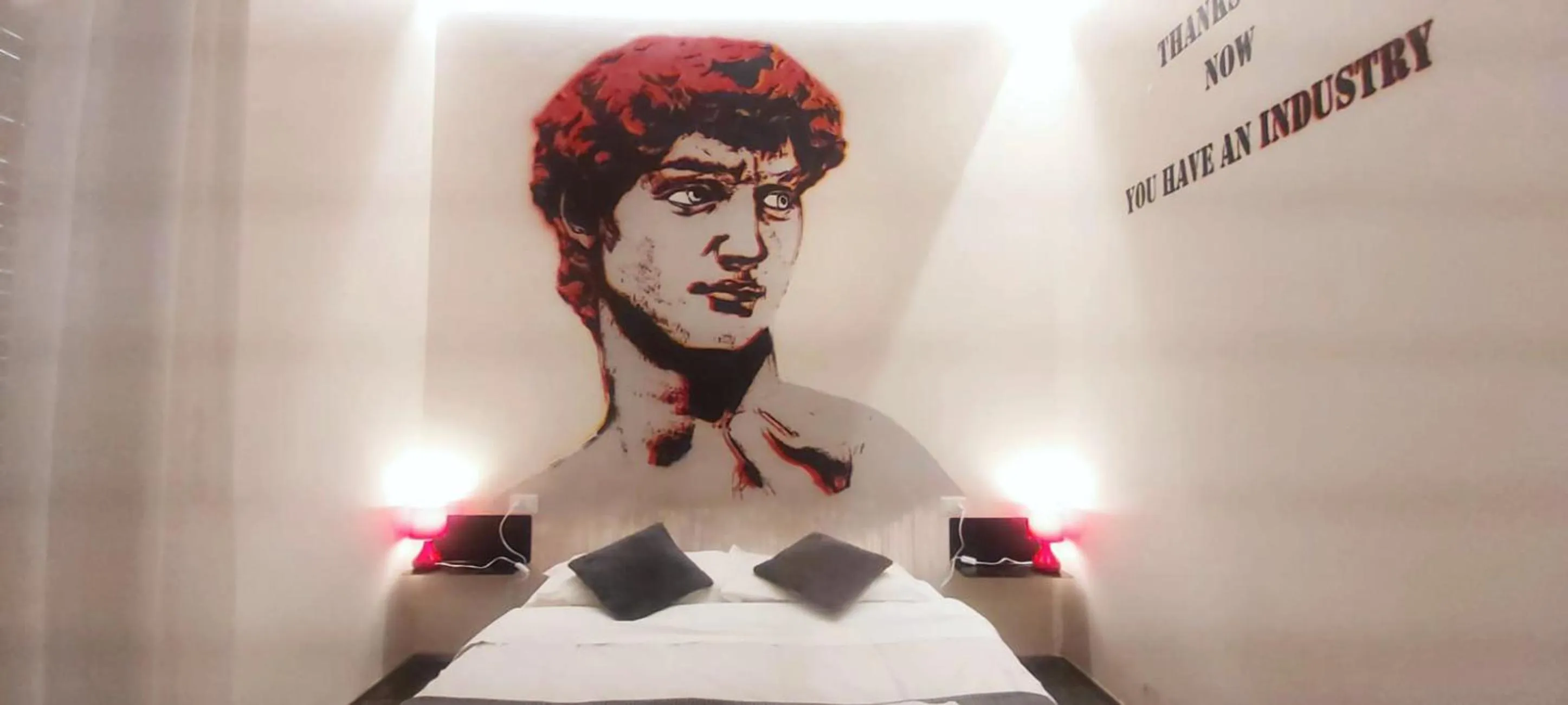 Bed in Street Art Inn Florence