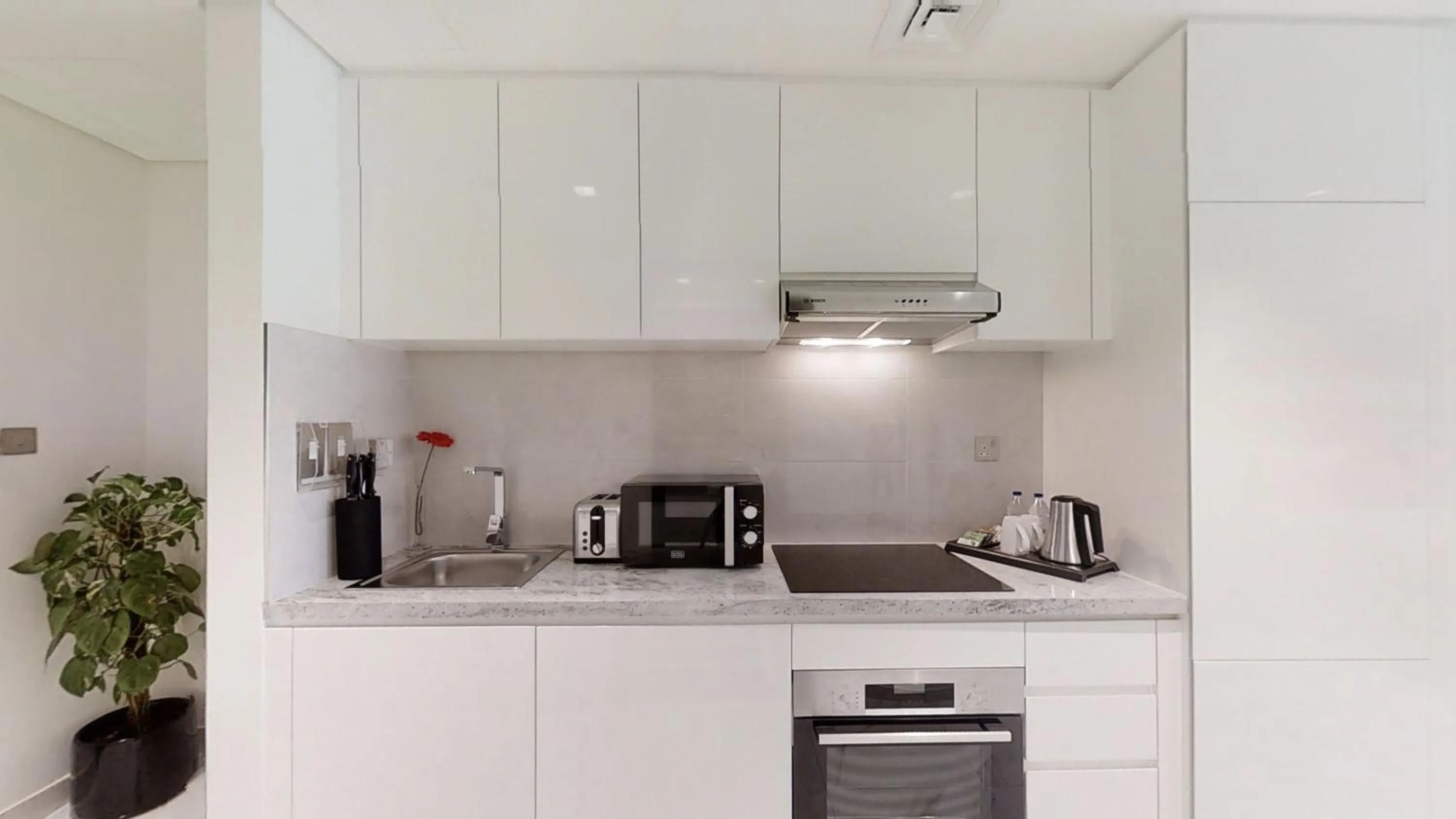 Kitchen or kitchenette in SUHA Mina Rashid Hotel Apartments