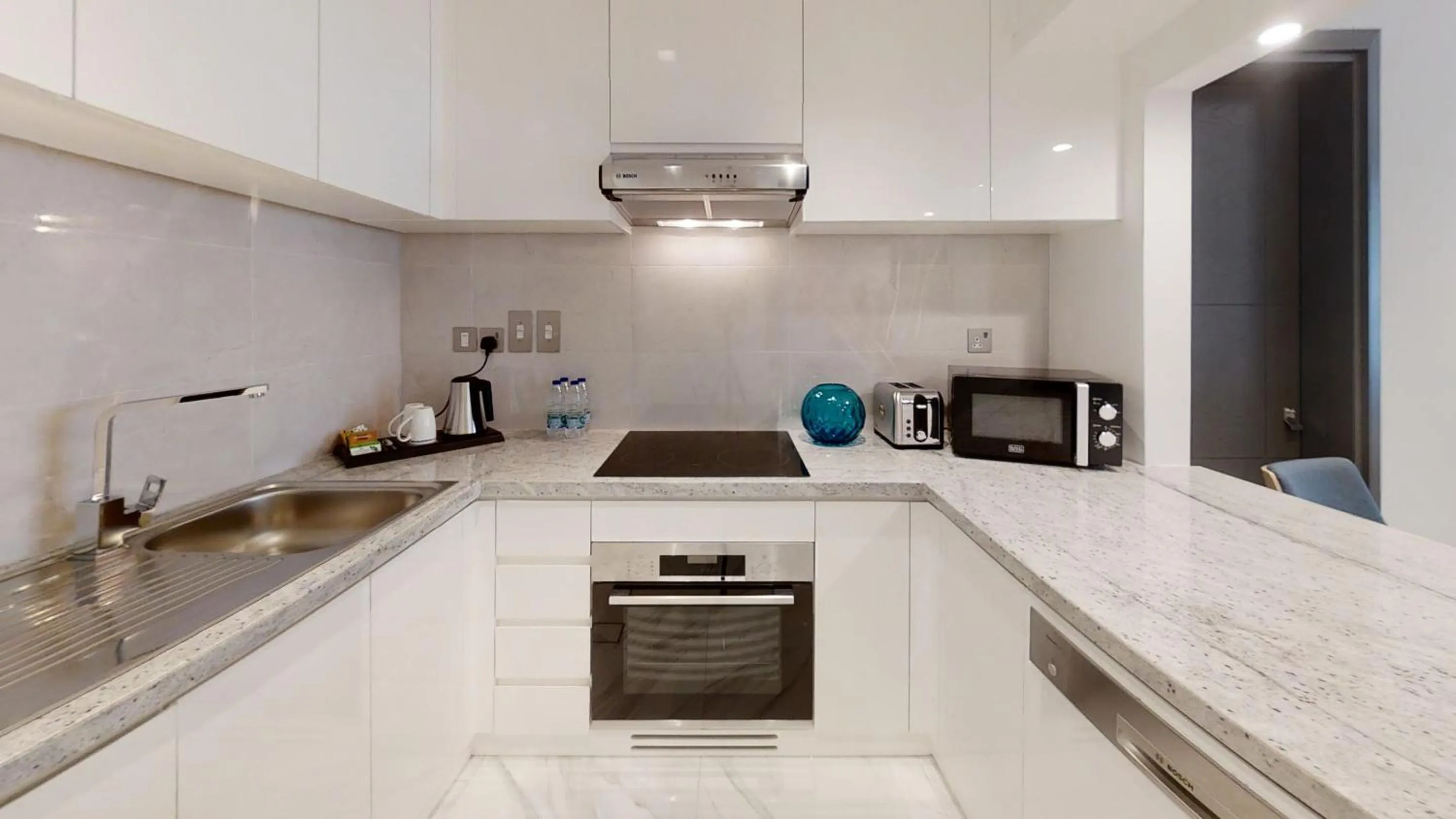 Kitchen or kitchenette in SUHA Mina Rashid Hotel Apartments