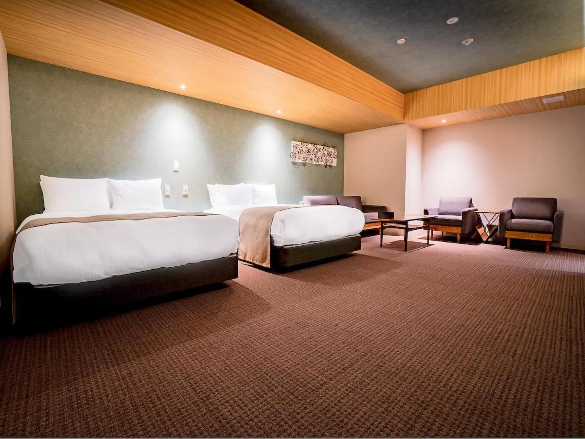 Bed in Randor Hotel Namba Osaka Suites