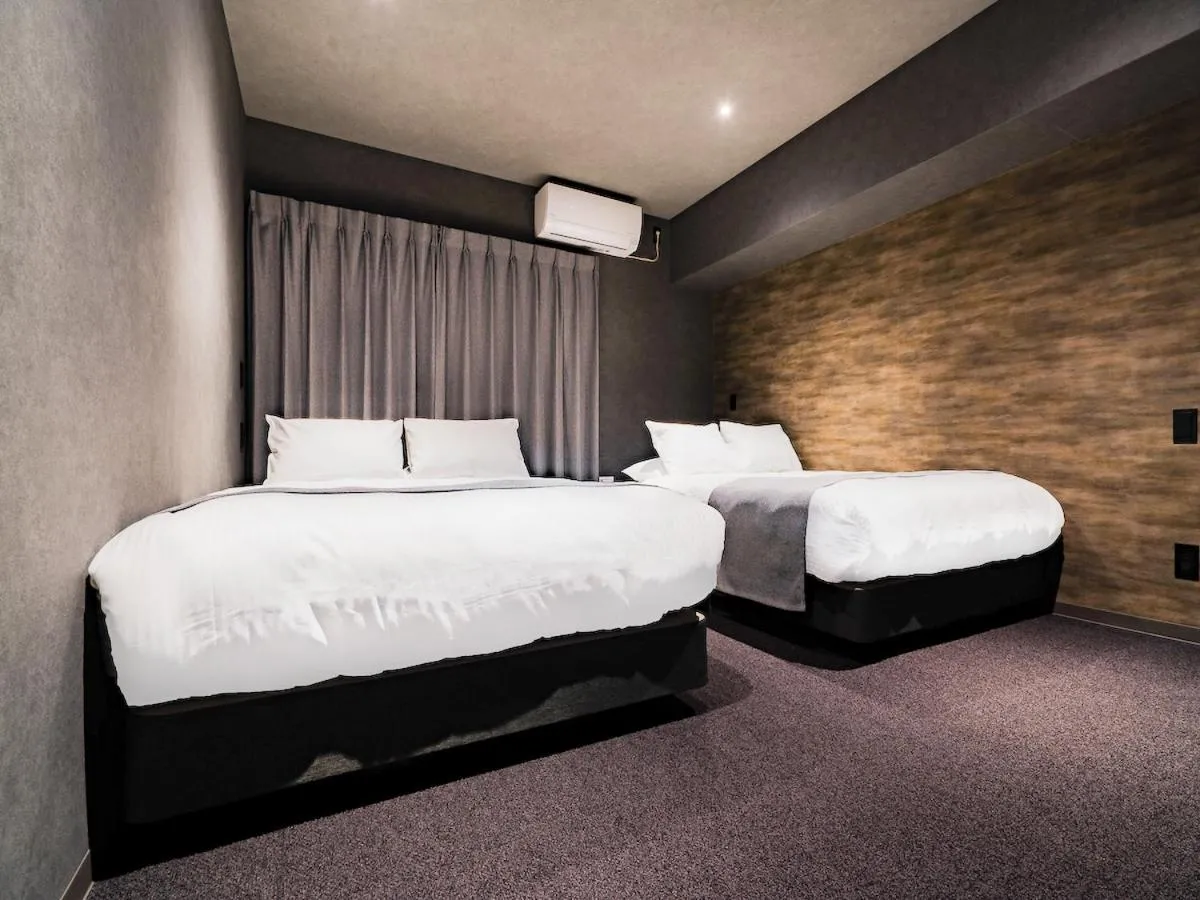 Bed in Randor Hotel Namba Osaka Suites