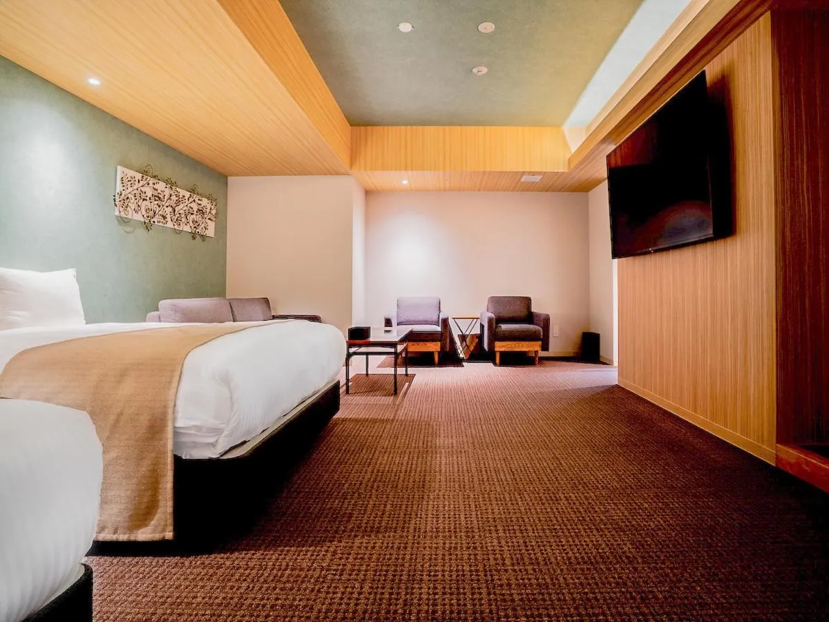 Bed in Randor Hotel Namba Osaka Suites