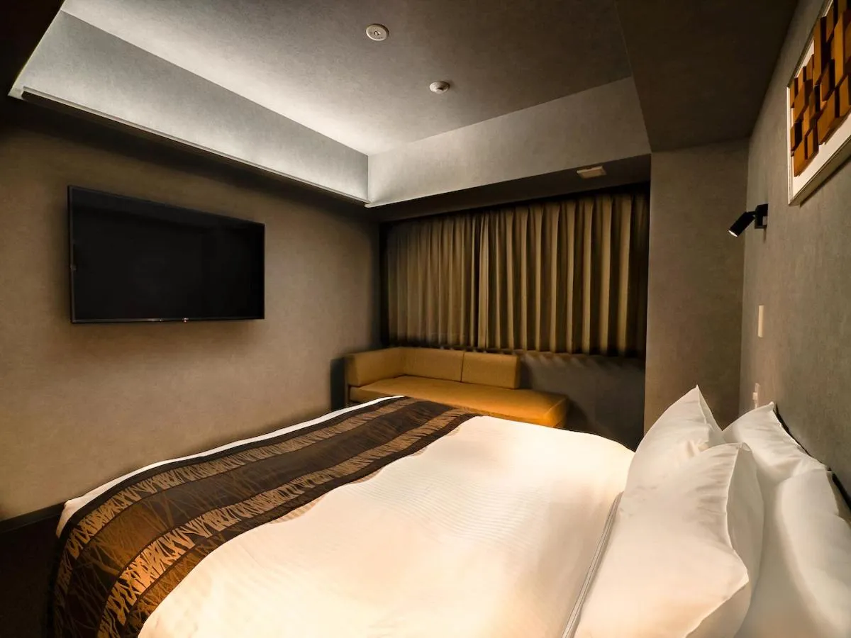 Bed in Randor Hotel Namba Osaka Suites