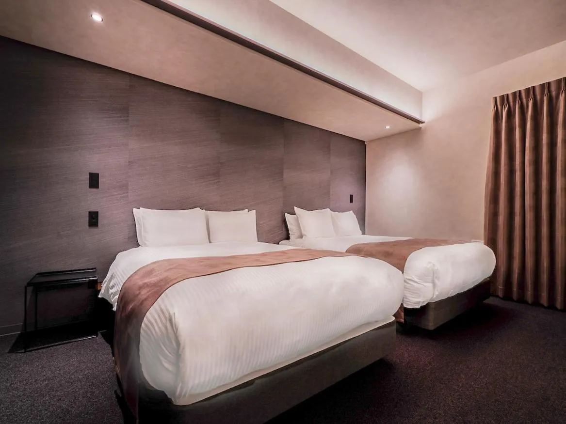 Bed in Randor Hotel Namba Osaka Suites