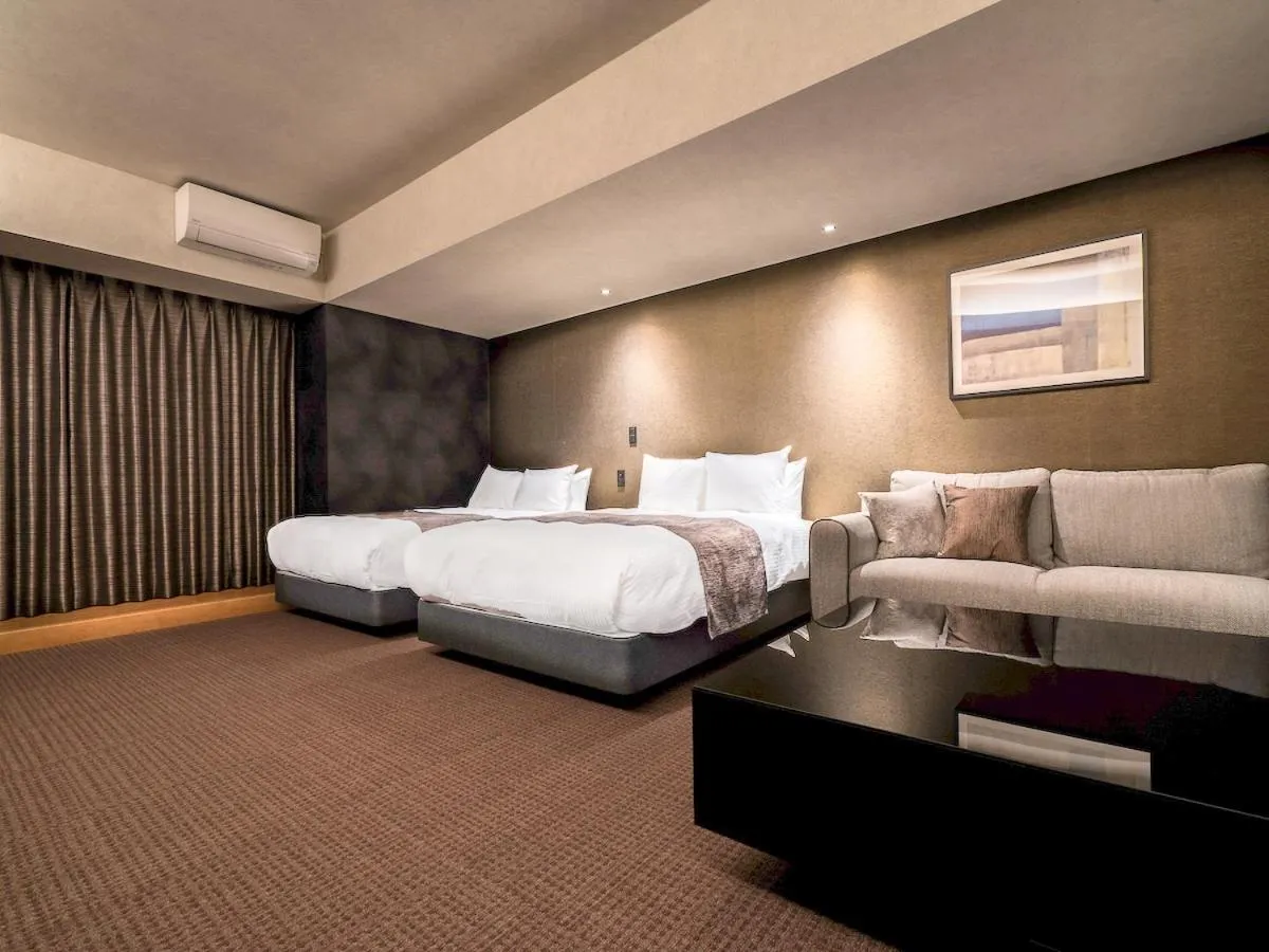 Bed in Randor Hotel Namba Osaka Suites