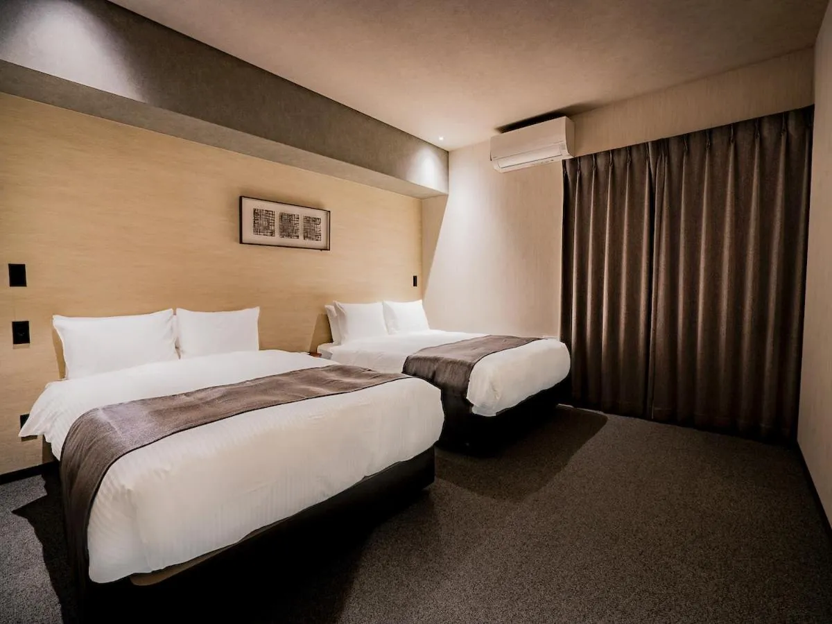 Bed in Randor Hotel Namba Osaka Suites