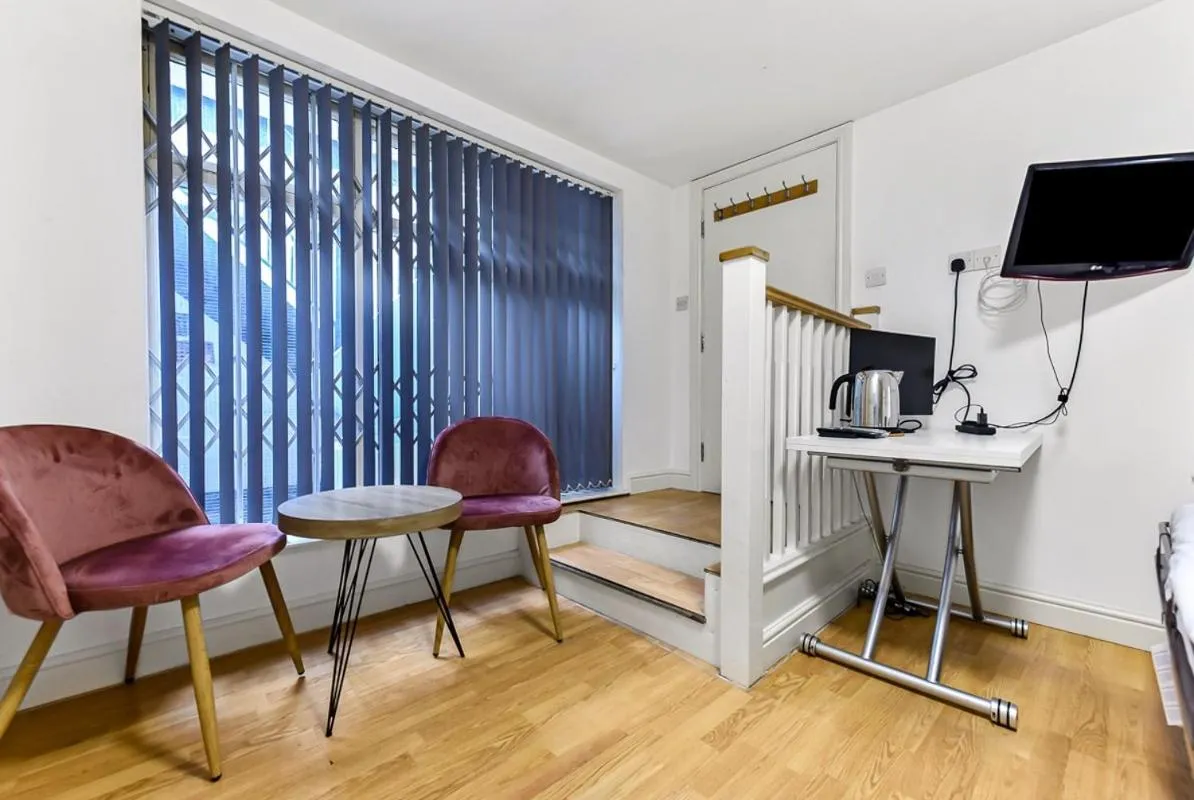 Seating area in Charlotte Street Rooms by News Hotel