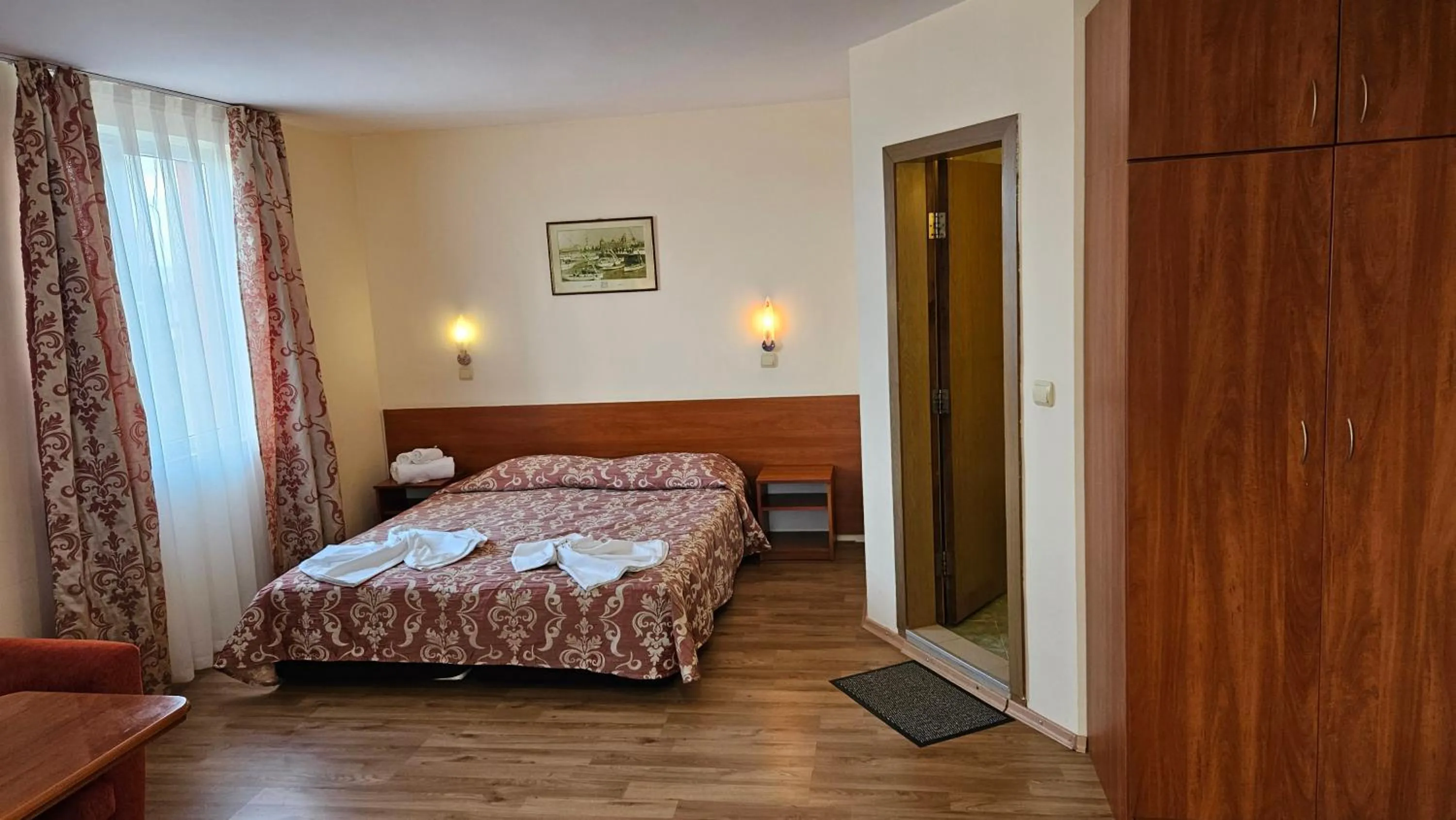 Bed in Caprice Family Hotel