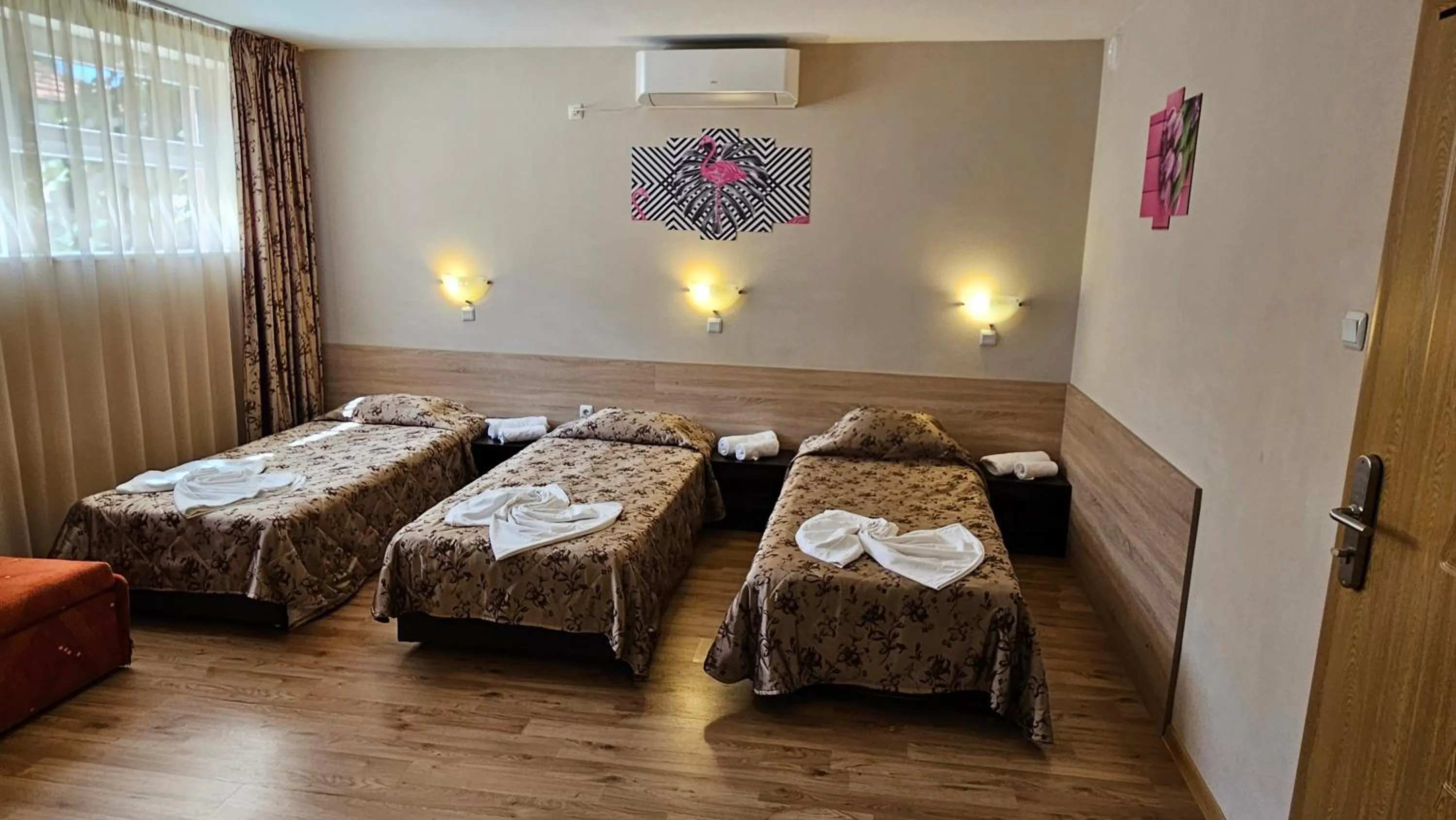 Bed in Caprice Family Hotel