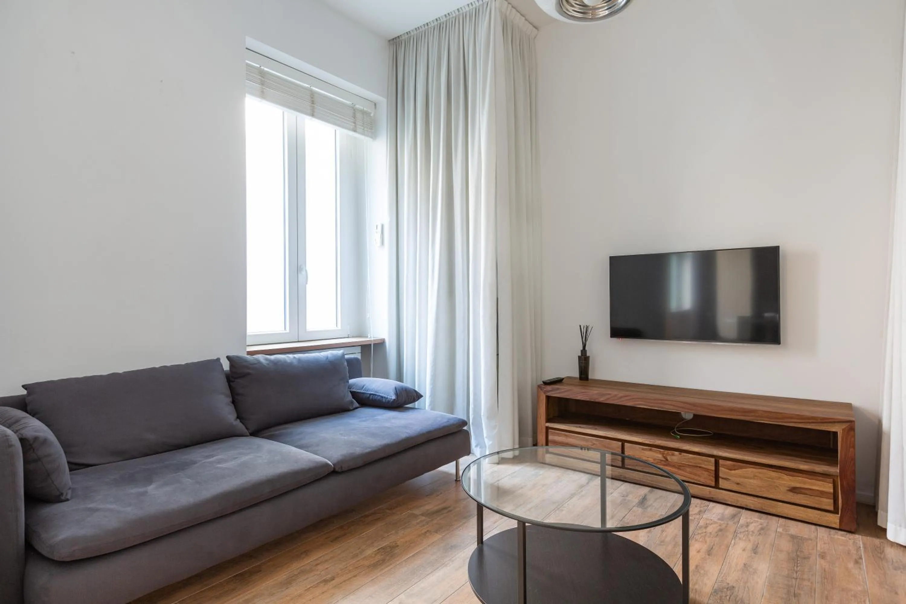 Living room in EasyTopStay - Tricolore Modern and Cozy Apartment