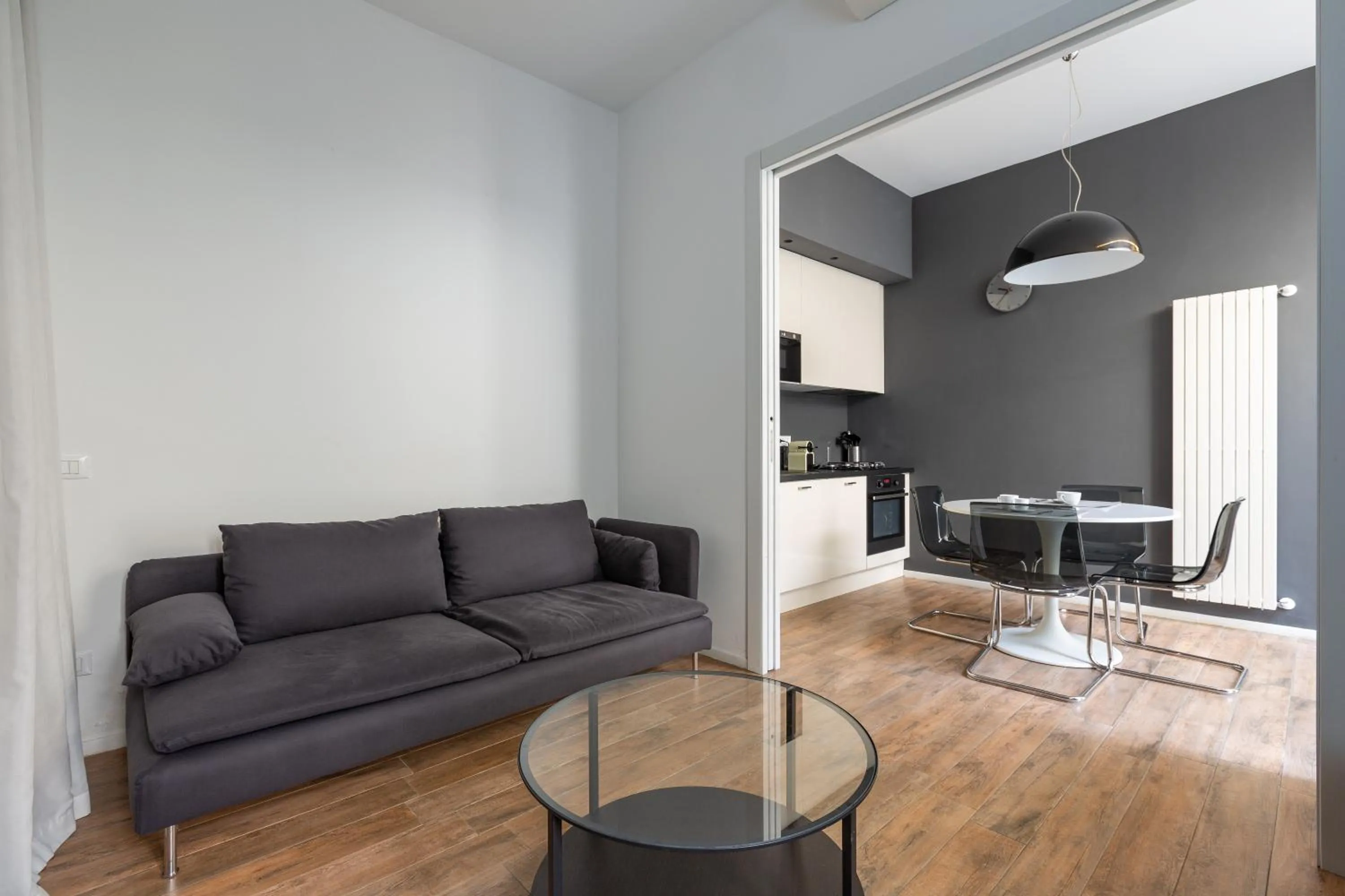 Living room in EasyTopStay - Tricolore Modern and Cozy Apartment