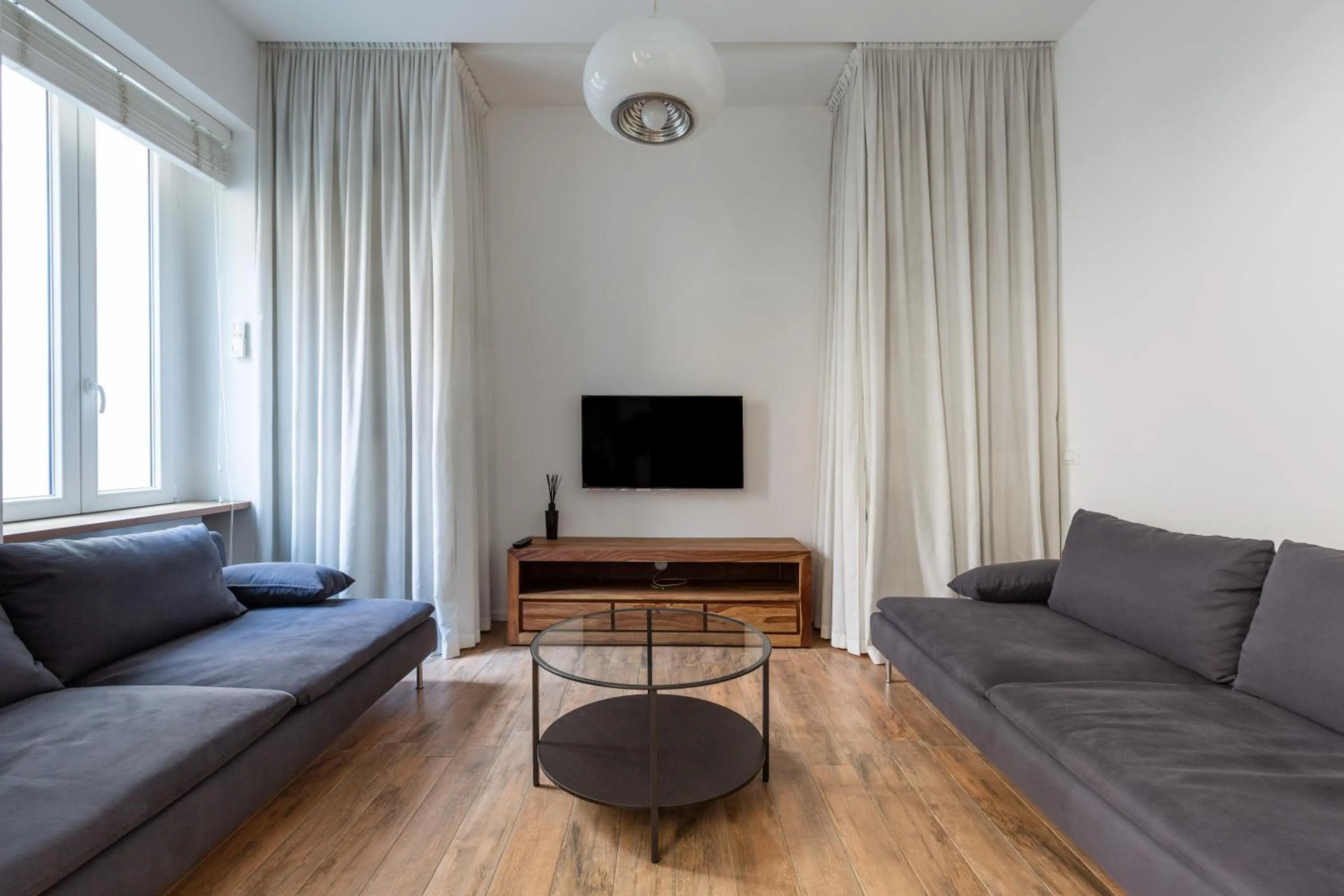 Living room in EasyTopStay - Tricolore Modern and Cozy Apartment