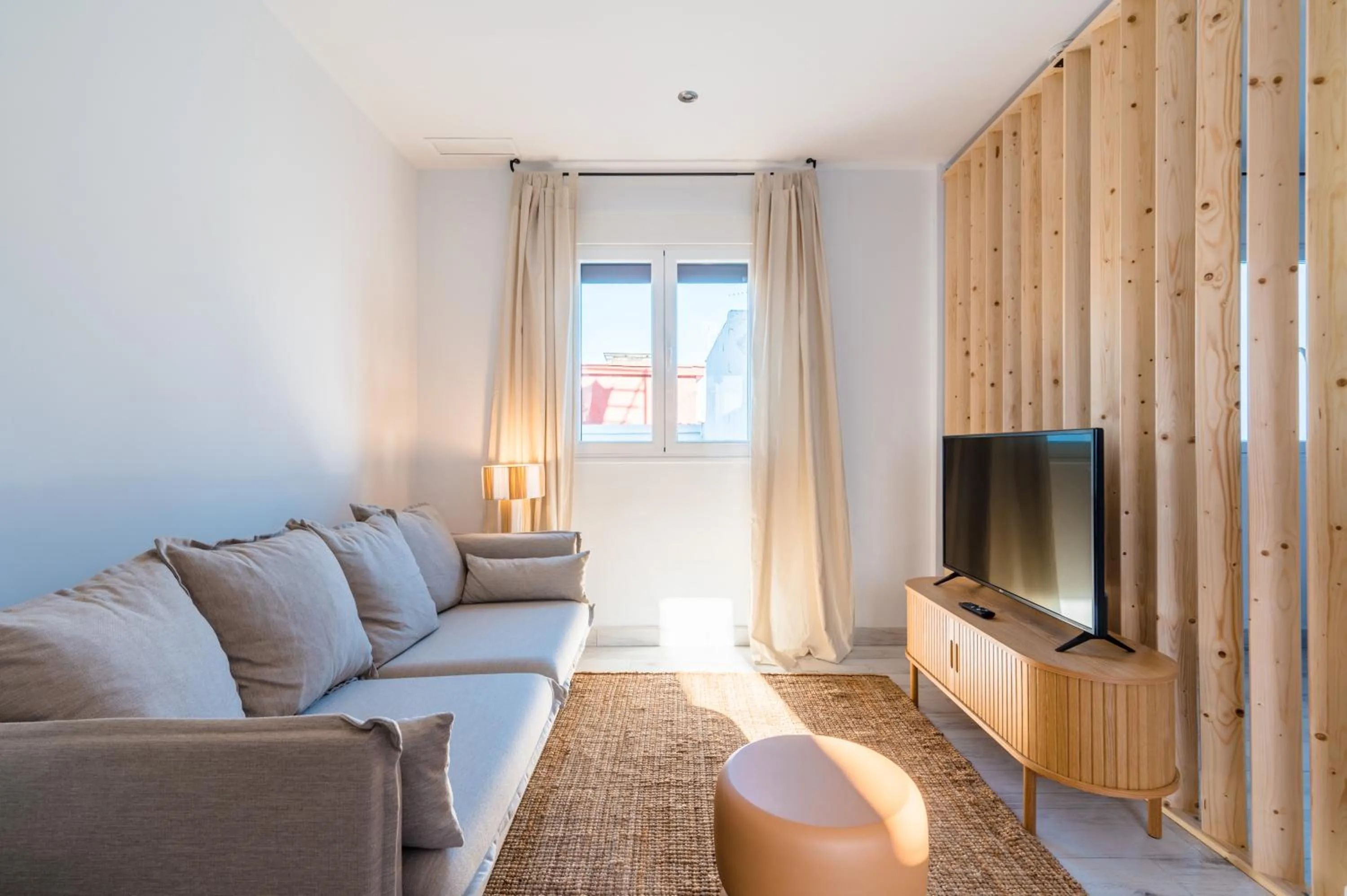 Communal lounge/ TV room in Apartamentos "El Escondite de Triana"