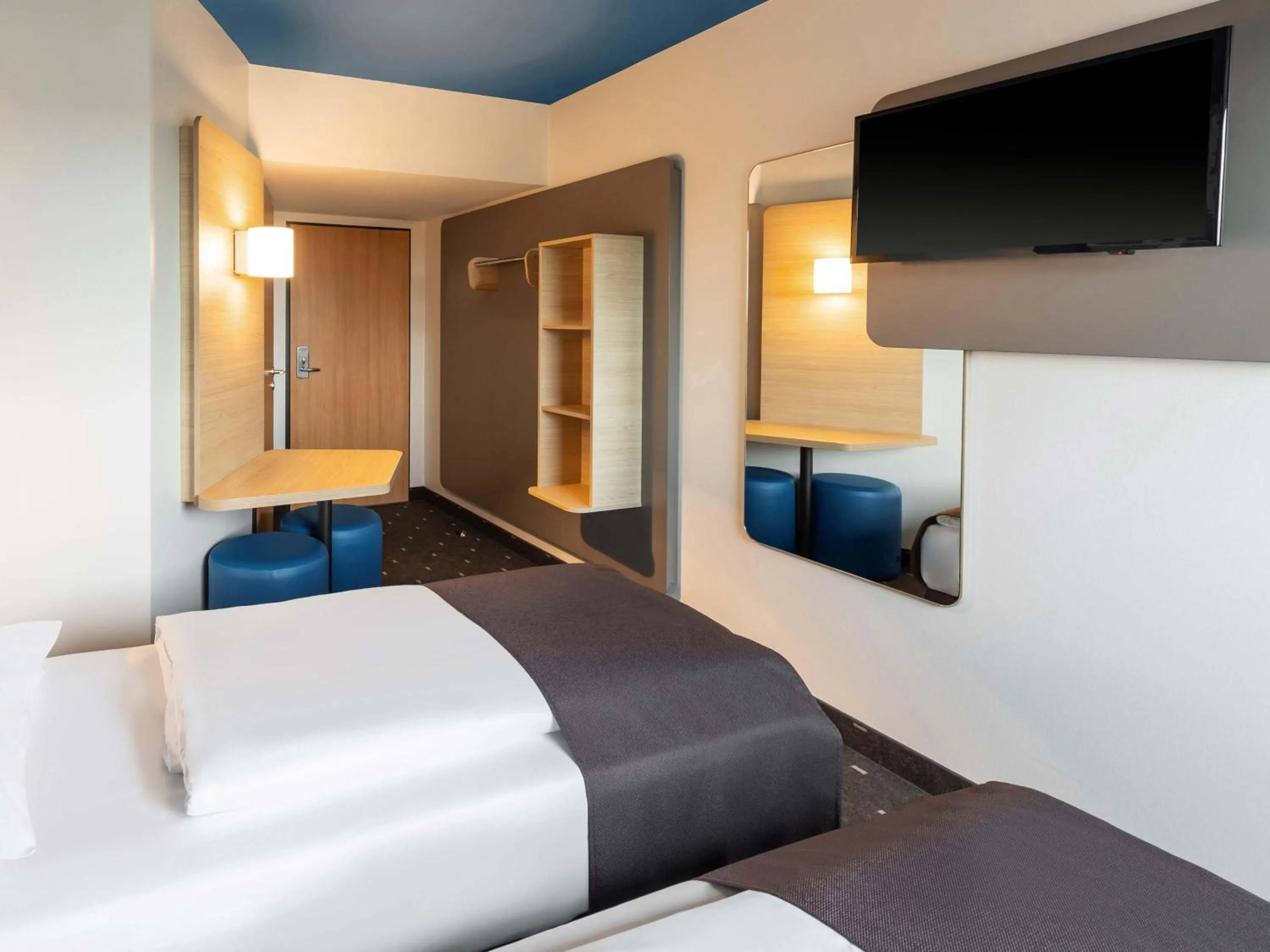 Photo of the whole room, Bed in B&B HOTEL Frankfurt-Hahn Airport