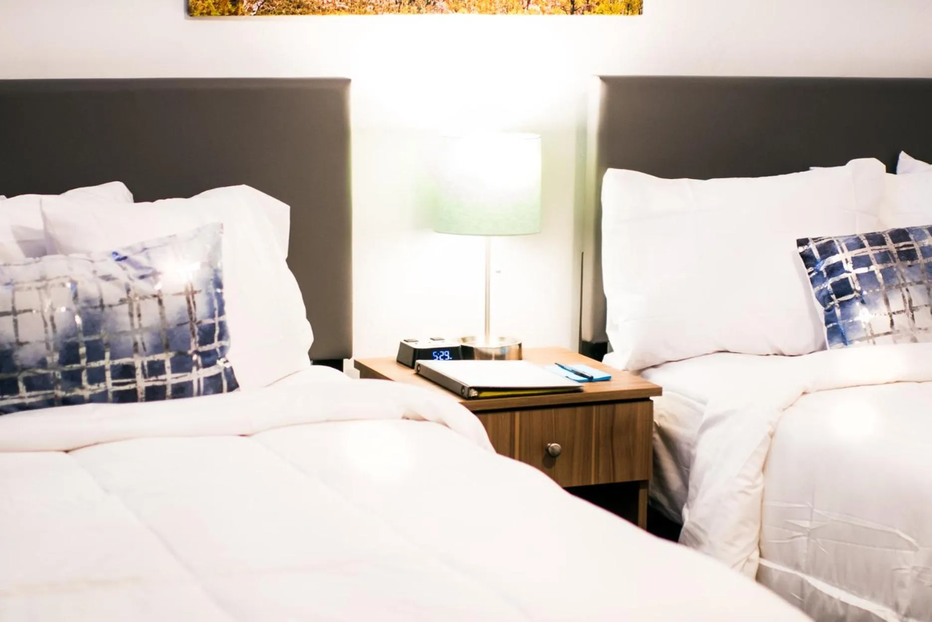 Bed in Blue Sage Inn & Suites