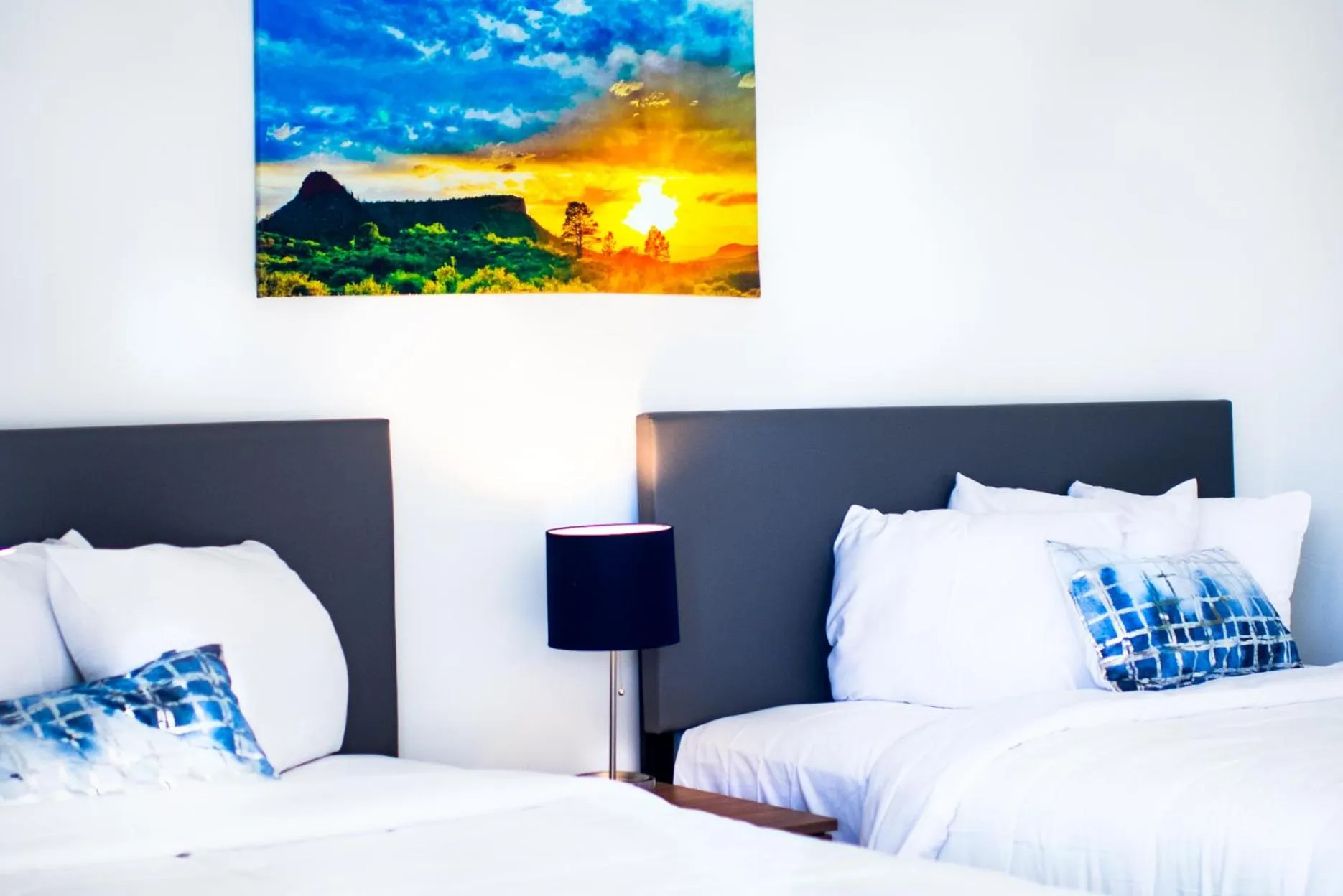 Bed in Blue Sage Inn & Suites